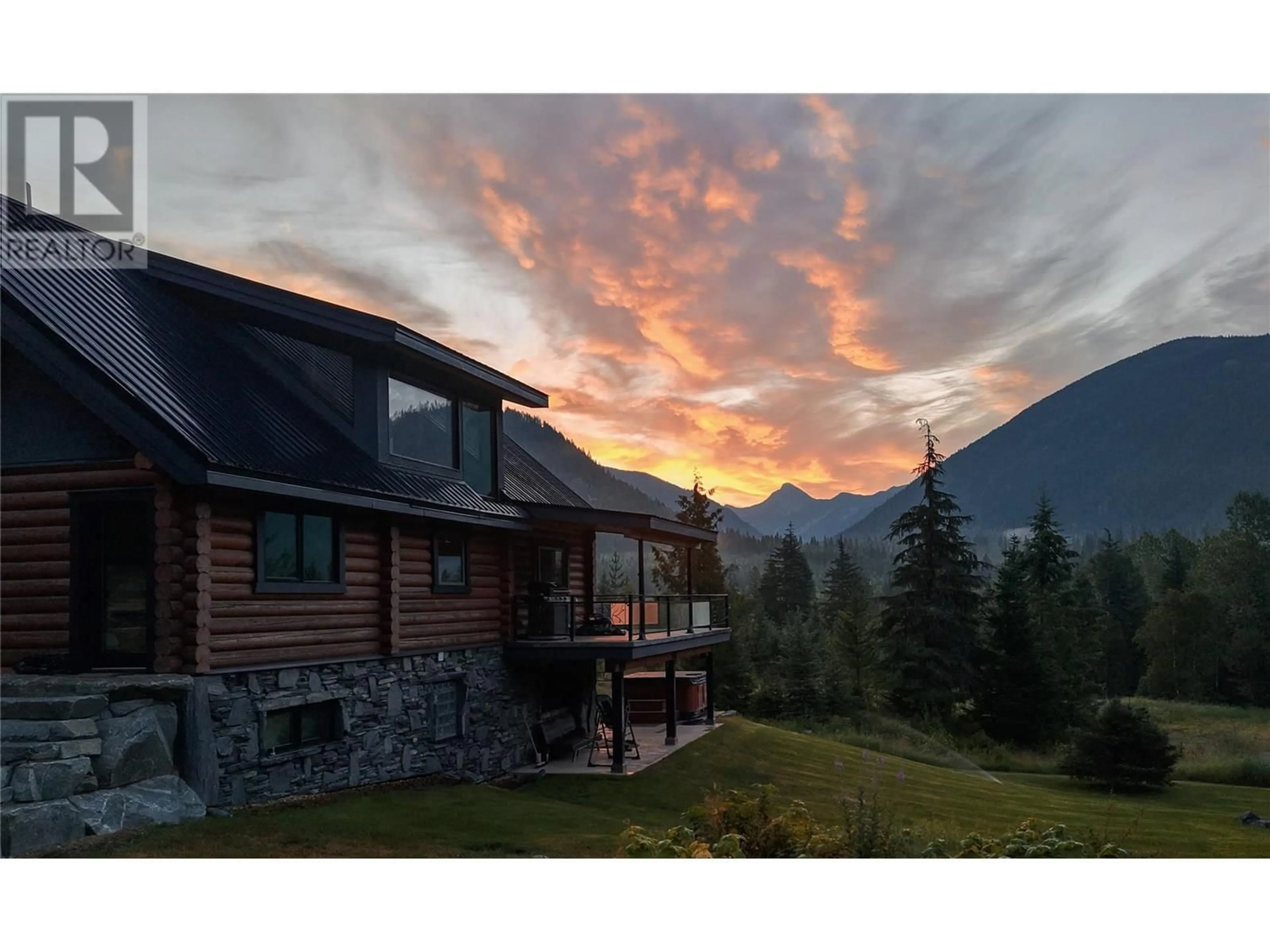 A pic from outside/outdoor area/front of a property/back of a property/a pic from drone, mountain view for 6580 6 HIGHWAY, Ymir British Columbia V0G2K0