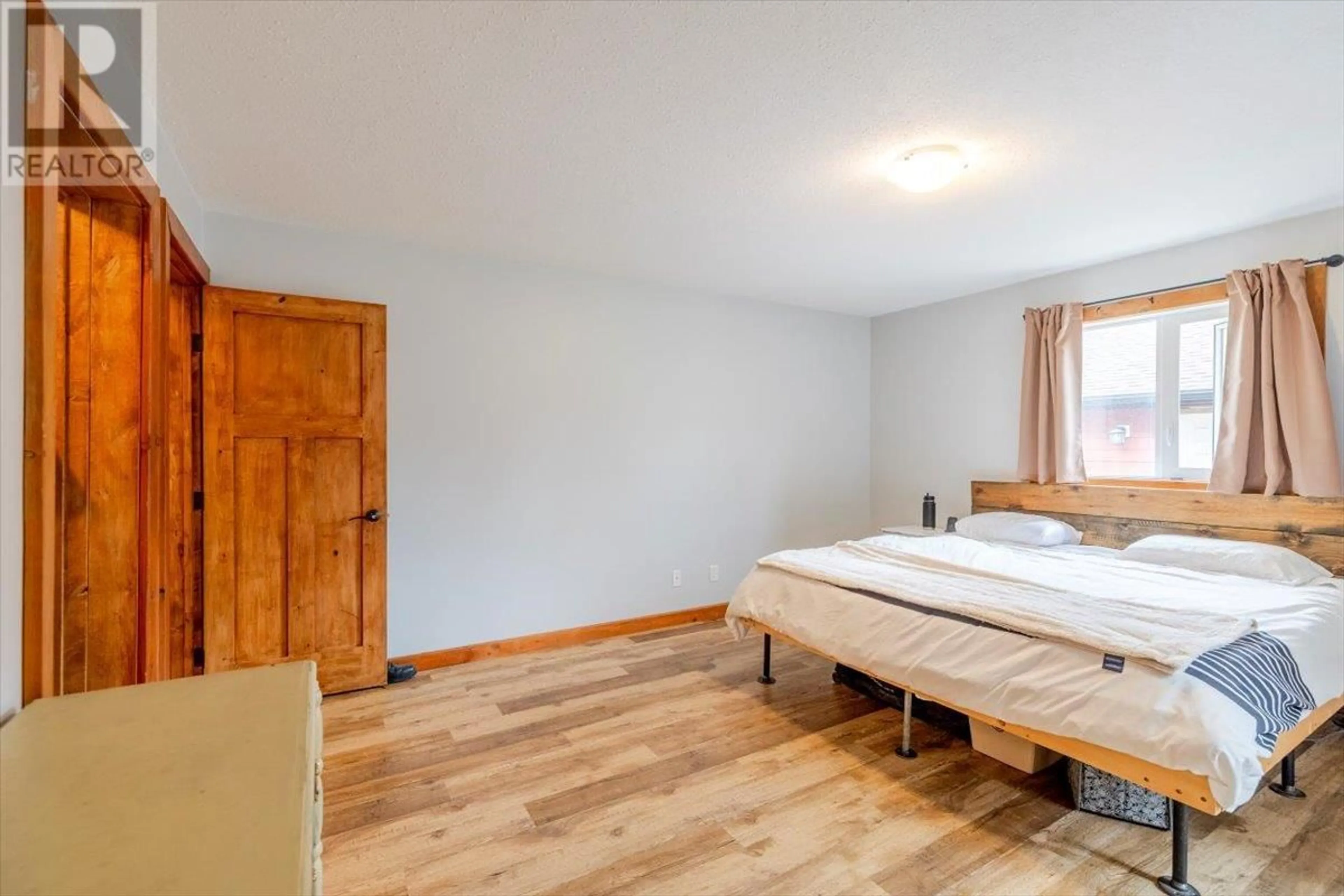 Bedroom with bed, wood/laminate floor for 2074 GOLDEN EAGLE DRIVE, Sparwood British Columbia V0B2G2