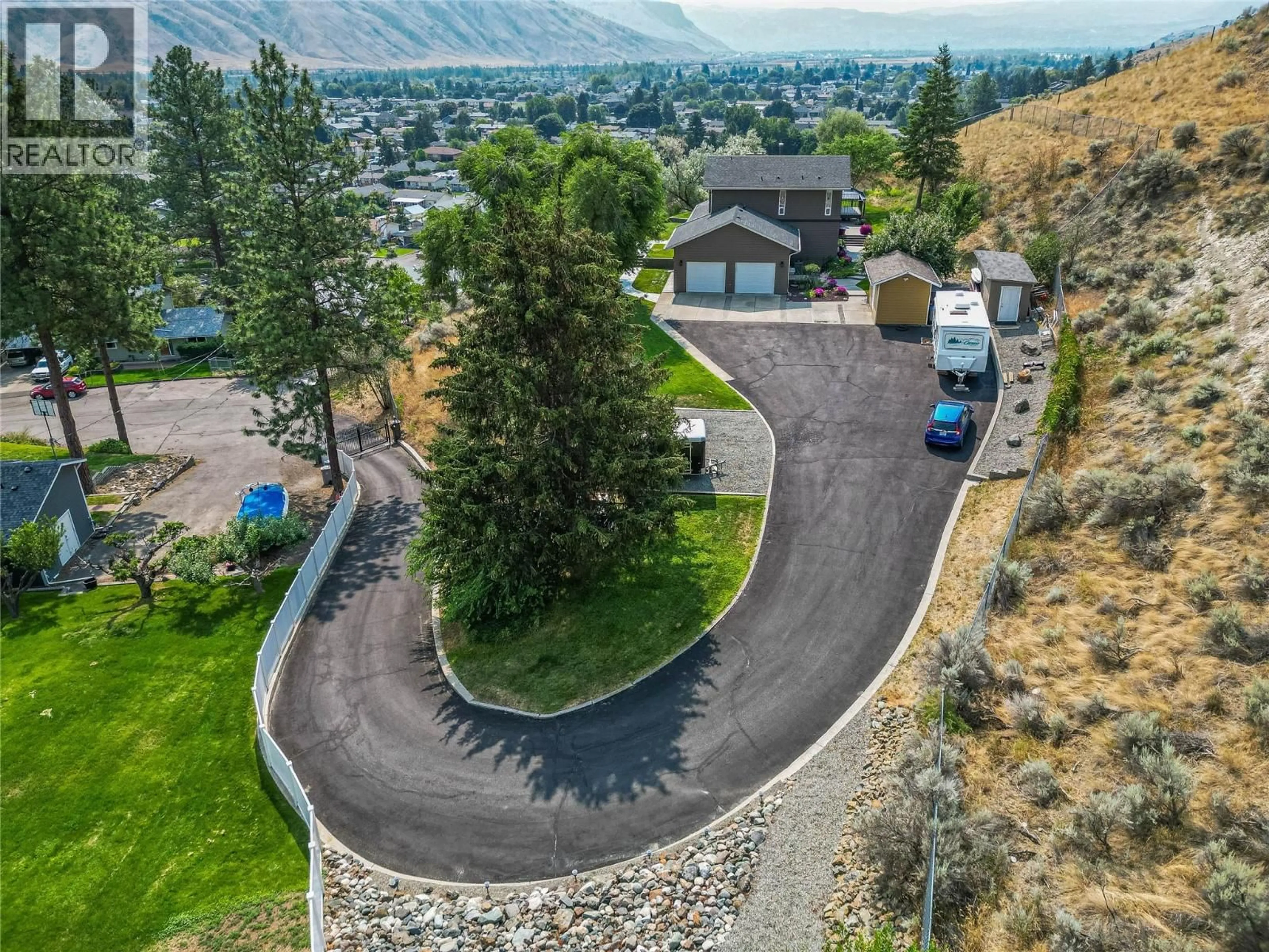 A pic from outside/outdoor area/front of a property/back of a property/a pic from drone, mountain view for 3084 DOHM ROAD, Kamloops British Columbia V2B7L8