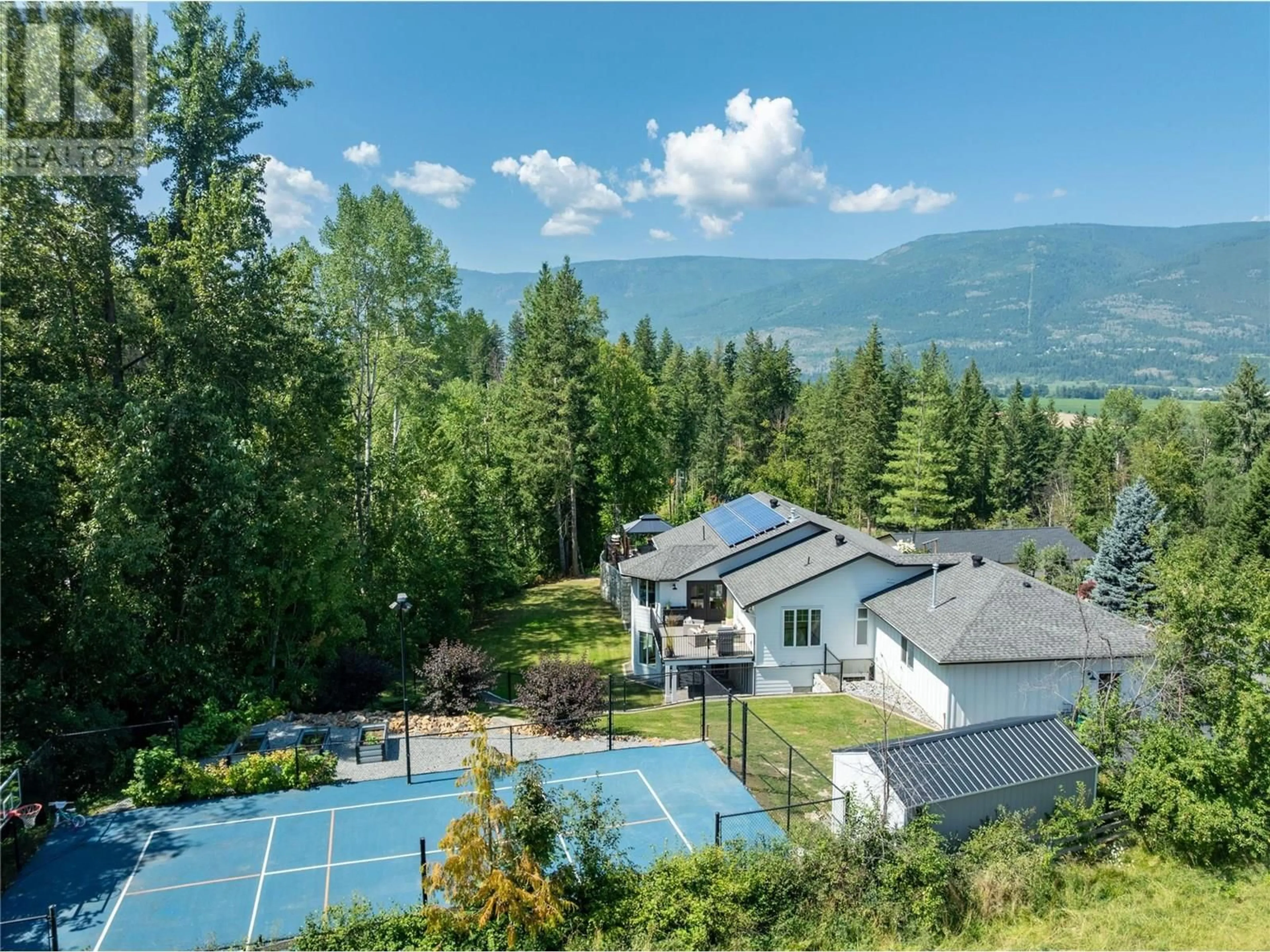 A pic from outside/outdoor area/front of a property/back of a property/a pic from drone, mountain view for 1800 FOOTHILL ROAD SOUTHWEST, Salmon Arm British Columbia V1E1L7