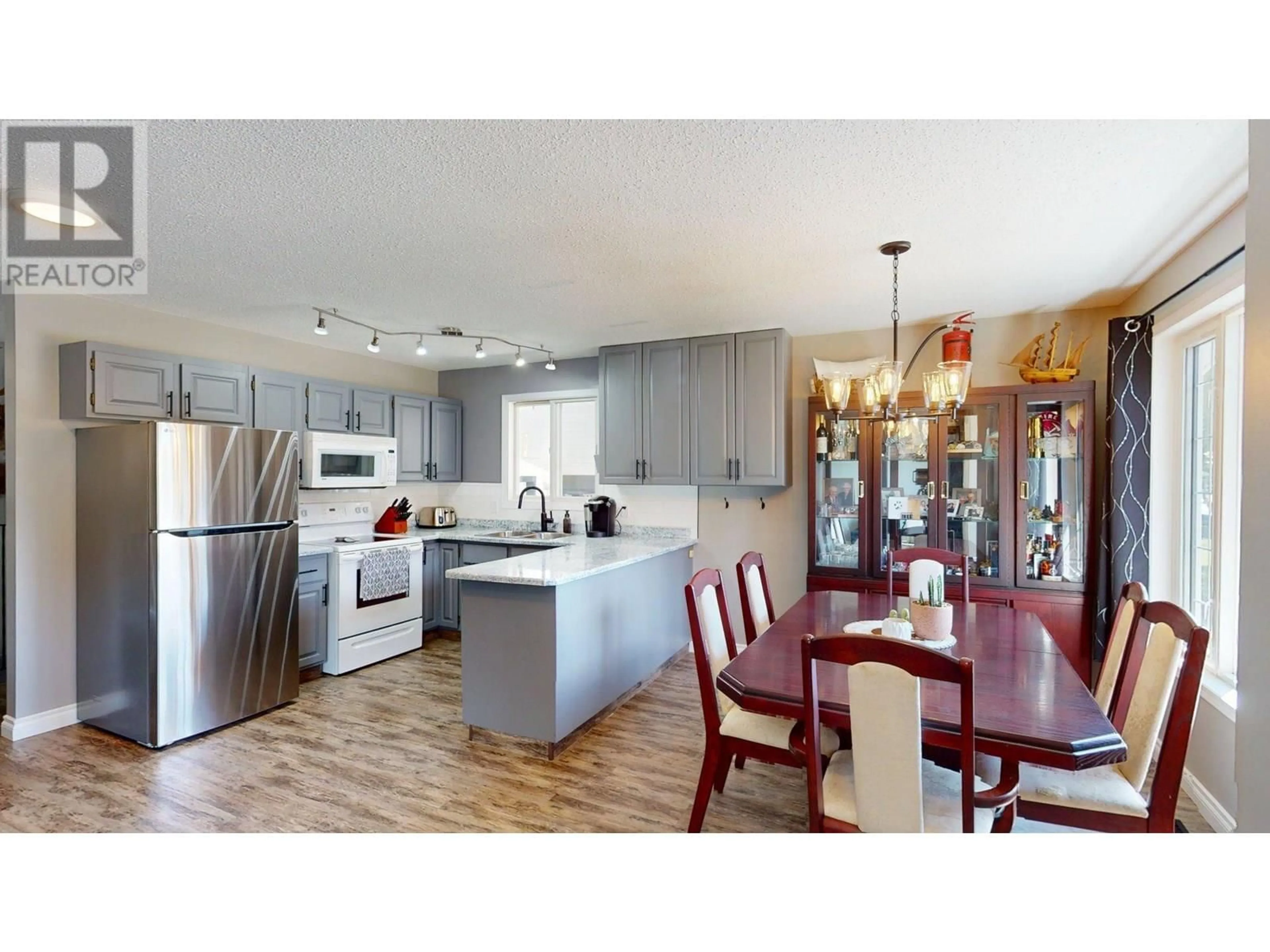 Open concept kitchen, wood/laminate floor for 11 CASCADE CRESCENT, Elkford British Columbia V0B1H0