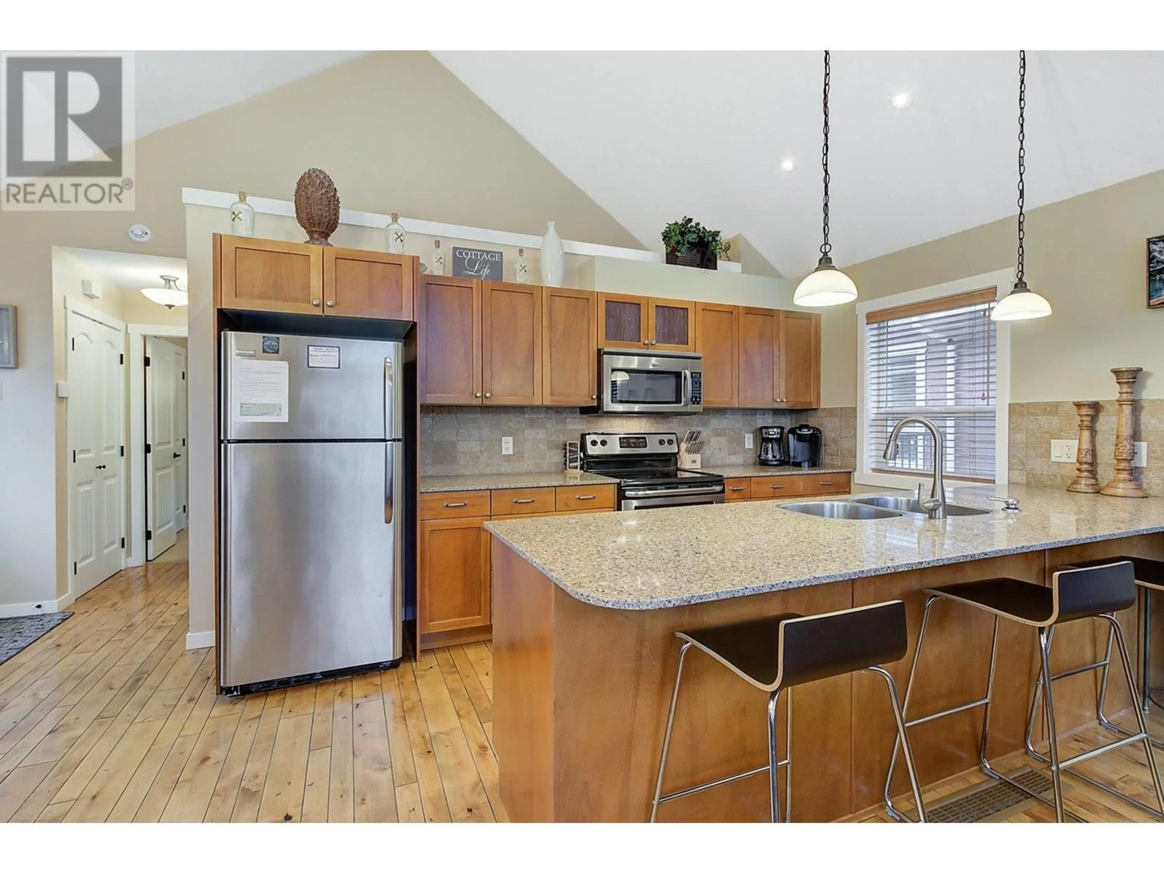 Open concept kitchen, unknown for 6823 MADRID WAY, Kelowna British Columbia V1Z3R8