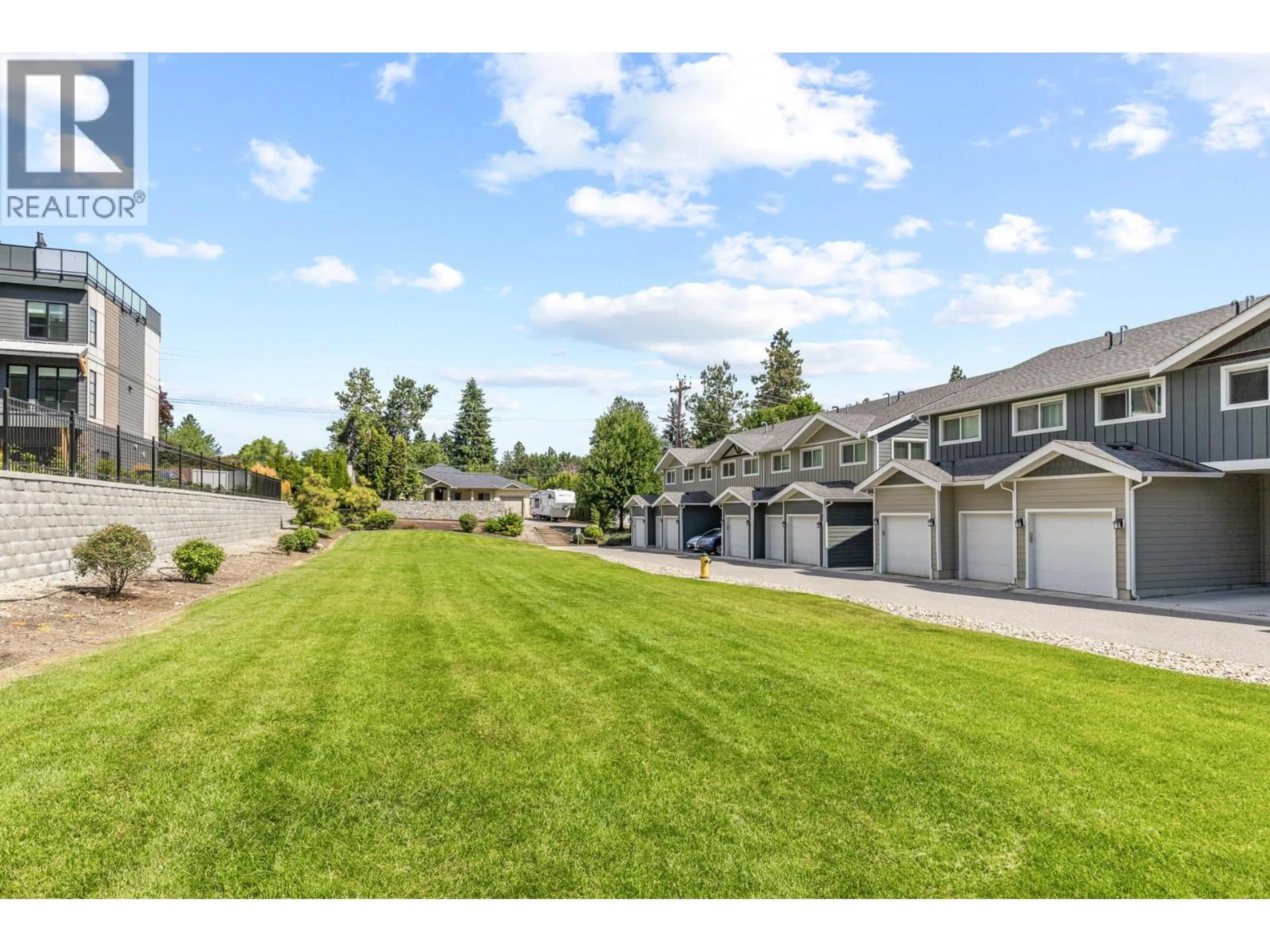 A pic from outside/outdoor area/front of a property/back of a property/a pic from drone, mountain view for 56 - 600 BOYNTON PLACE, Kelowna British Columbia V1V3B8
