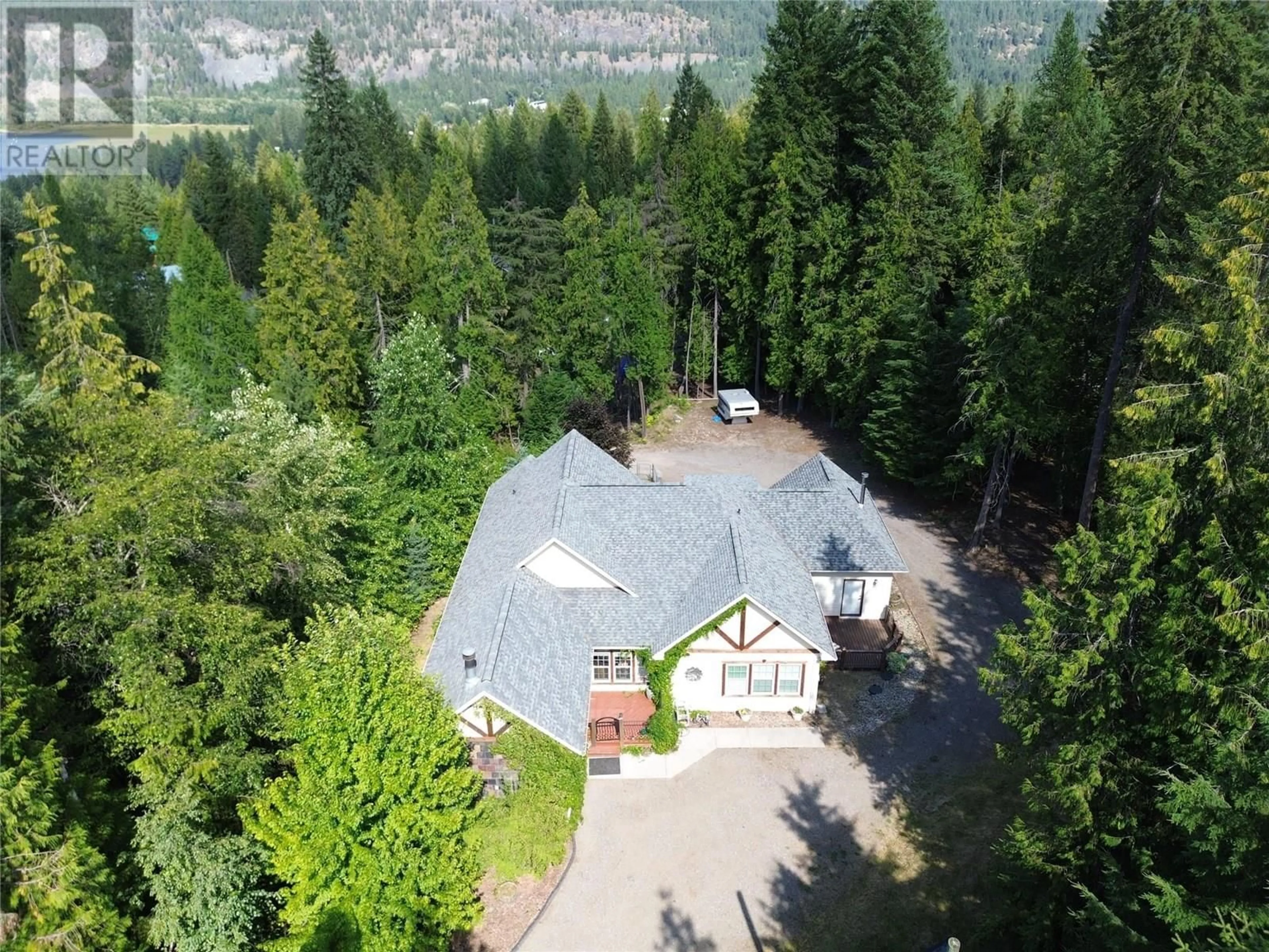 A pic from outside/outdoor area/front of a property/back of a property/a pic from drone, forest/trees view for 1615 BEECH ROAD, Christina Lake British Columbia V0H1E0