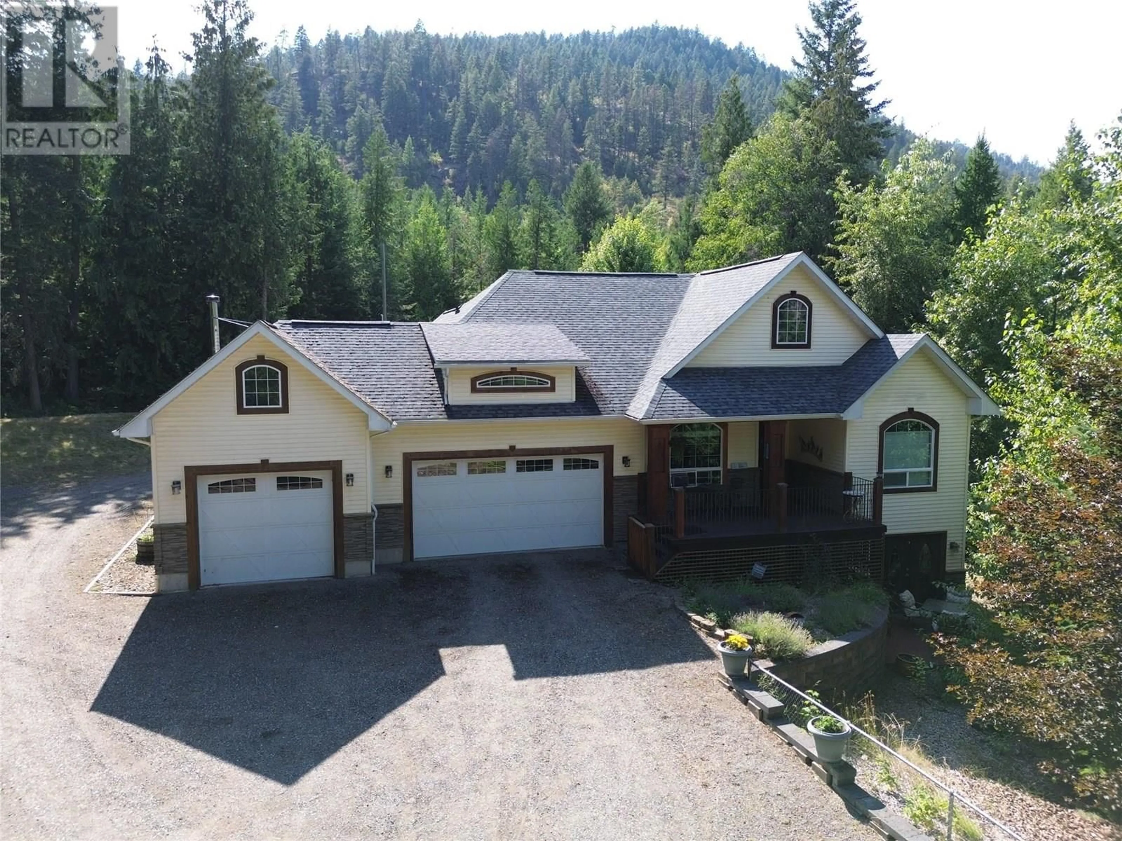 A pic from outside/outdoor area/front of a property/back of a property/a pic from drone, mountain view for 1615 BEECH ROAD, Christina Lake British Columbia V0H1E0