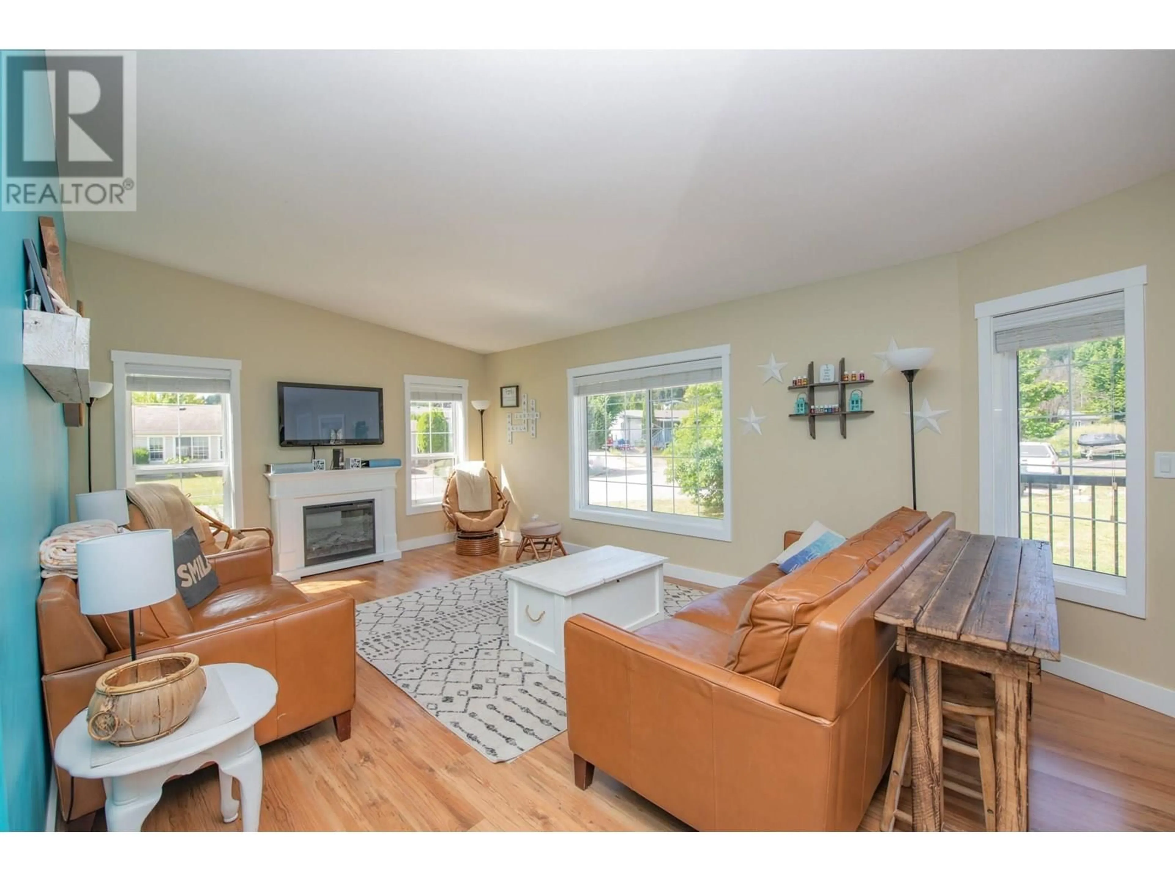 Living room with furniture, wood/laminate floor for 4781 73 AVENUE NORTHEAST, Canoe British Columbia V0E1K0