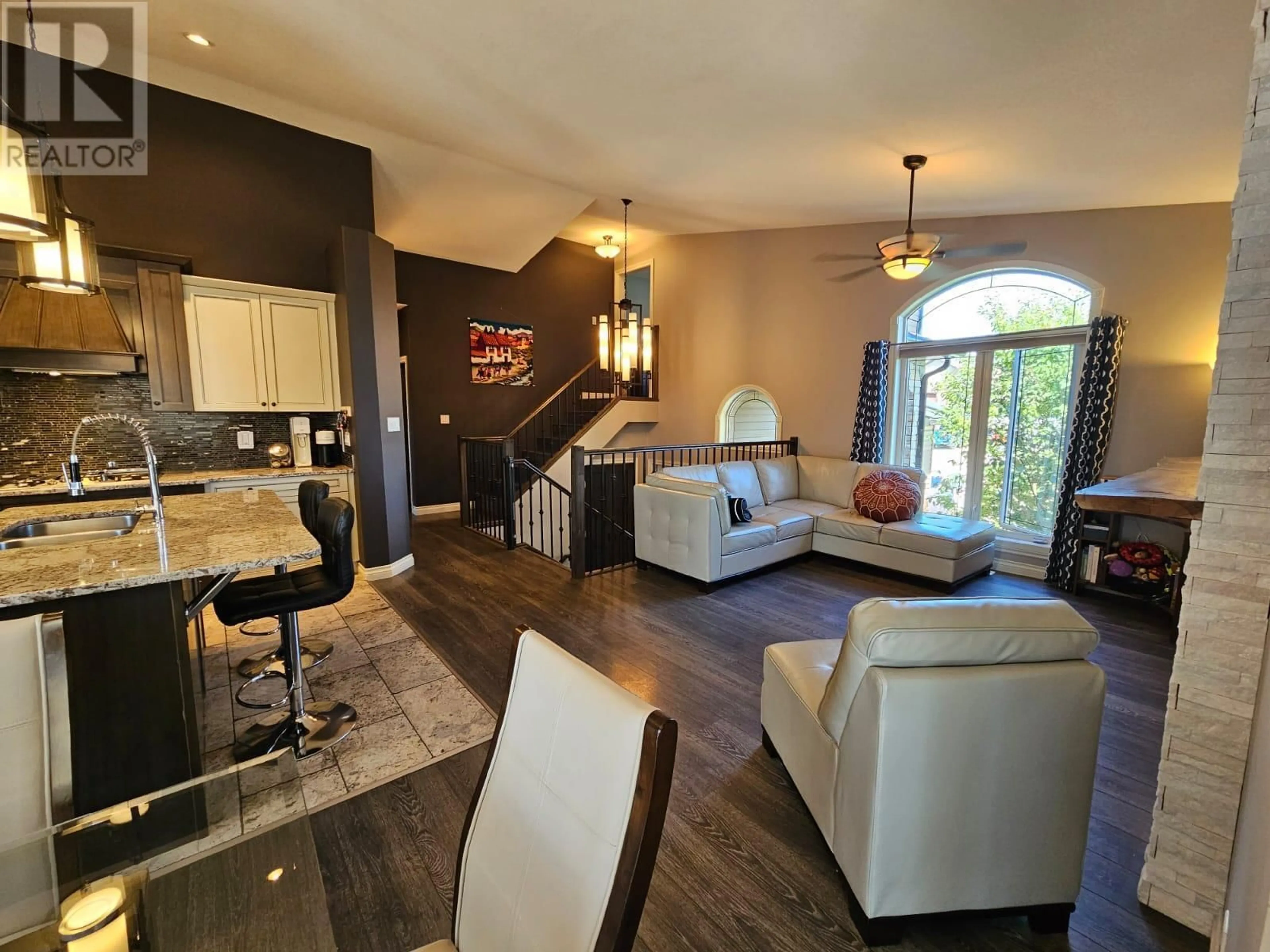 Living room with furniture, wood/laminate floor for 8409 18 STREET, Dawson Creek British Columbia V1G0E2