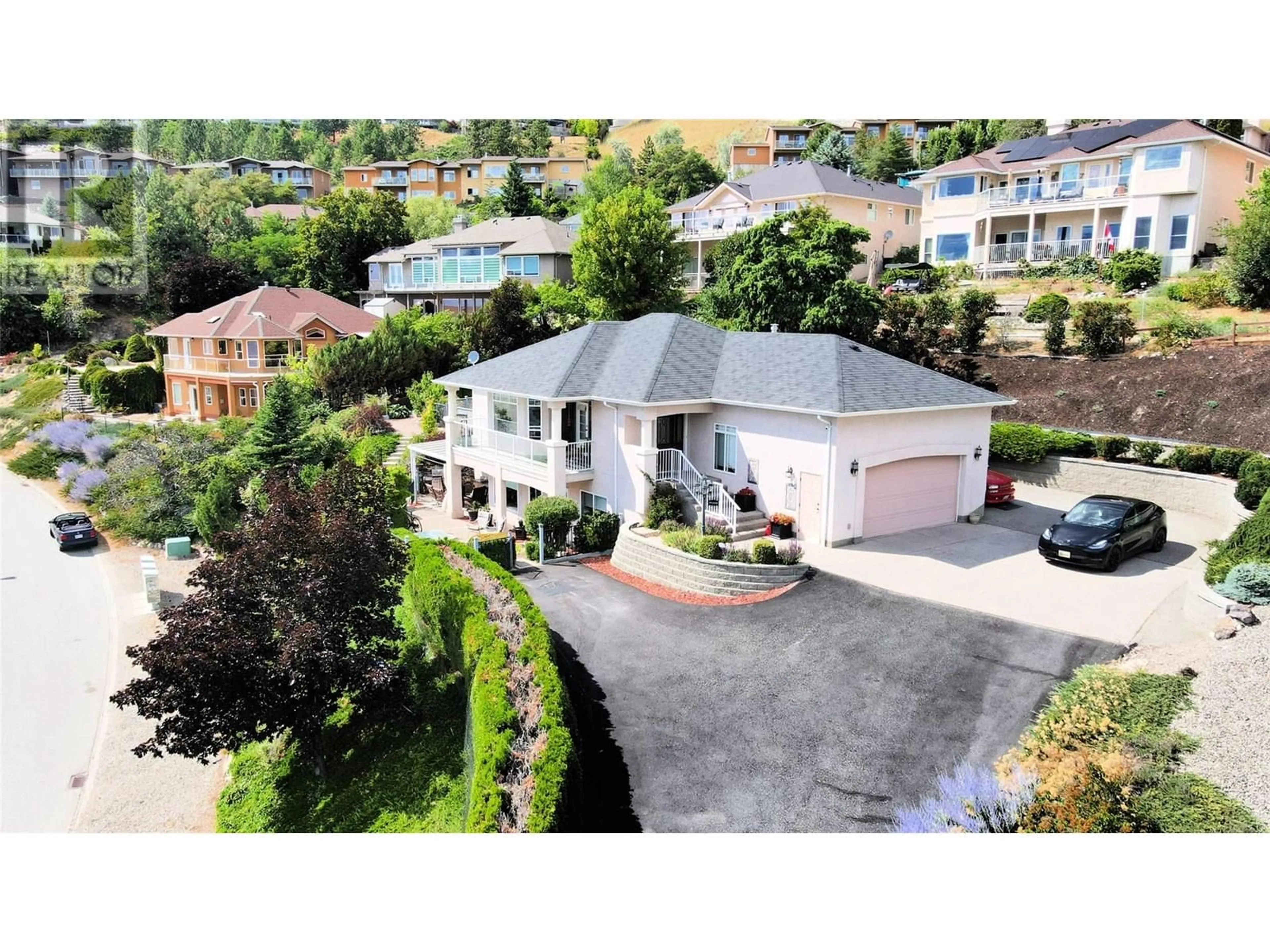 A pic from outside/outdoor area/front of a property/back of a property/a pic from drone, street for 5202 SUTHERLAND ROAD, Peachland British Columbia V0H1X2