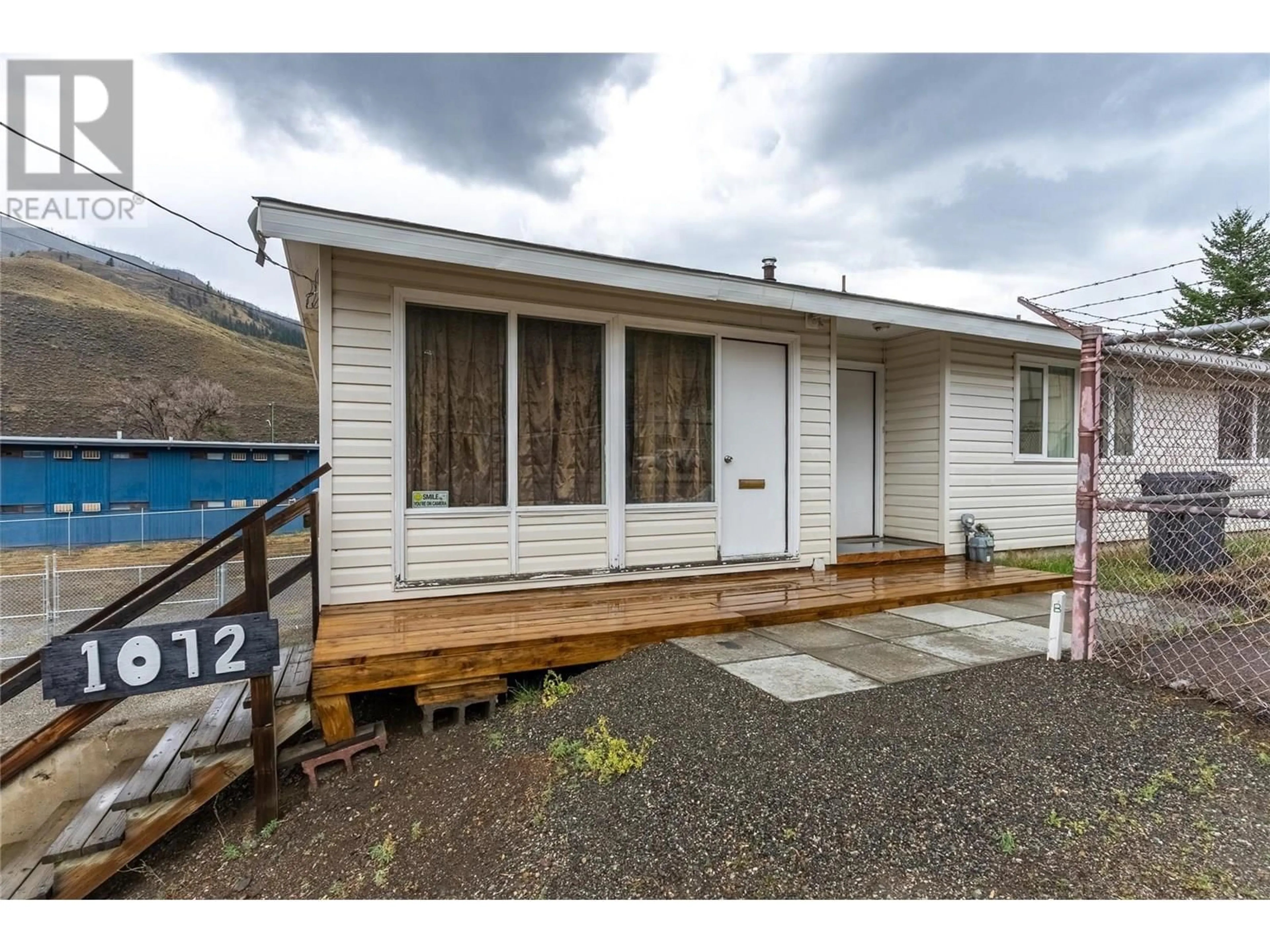 Home with vinyl exterior material, street for 1072 COLLINS ROAD, Cache Creek British Columbia V0K1H0