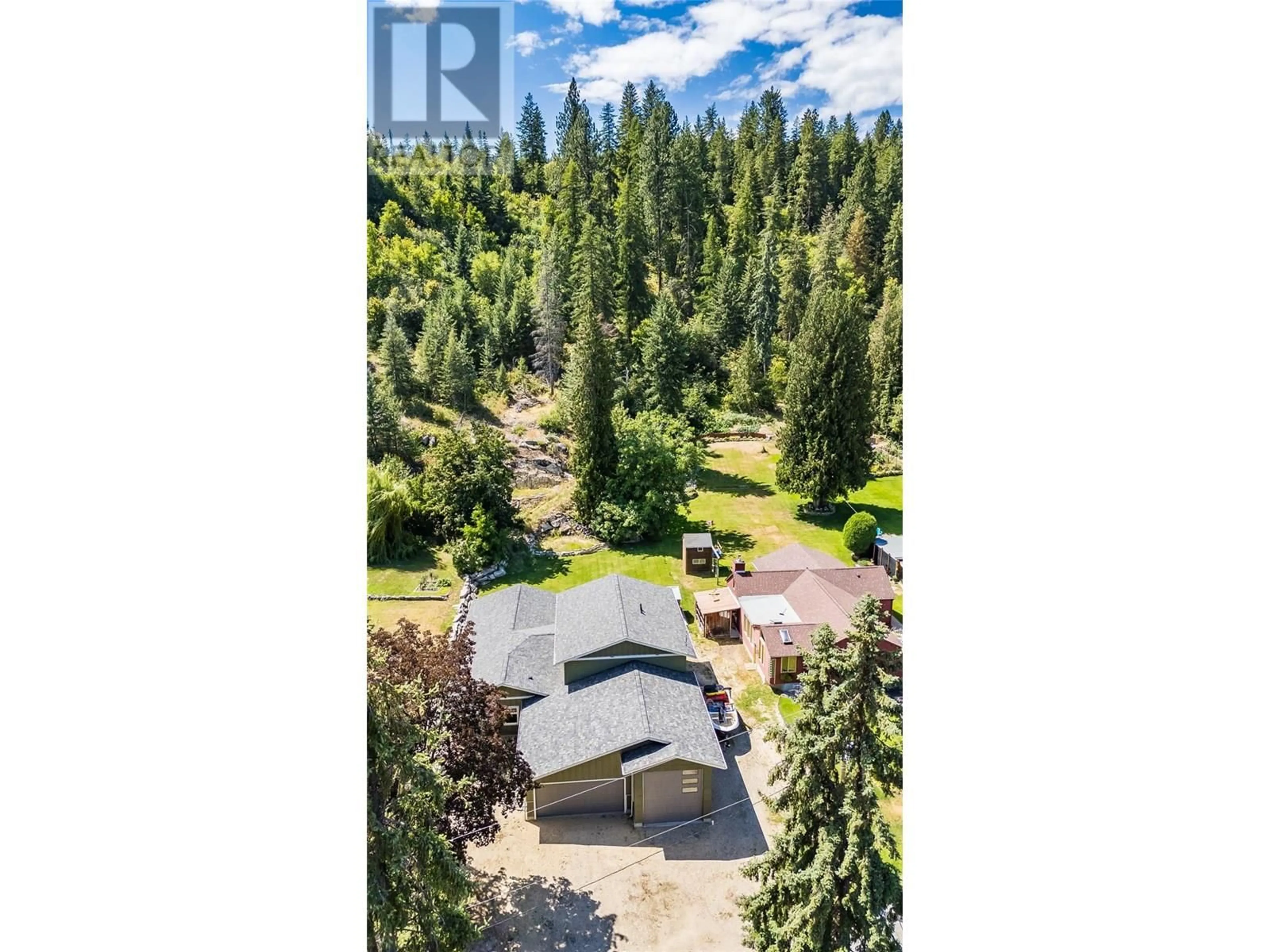 A pic from outside/outdoor area/front of a property/back of a property/a pic from drone, forest/trees view for 2640 10TH AVENUE, Castlegar British Columbia V1N2T9