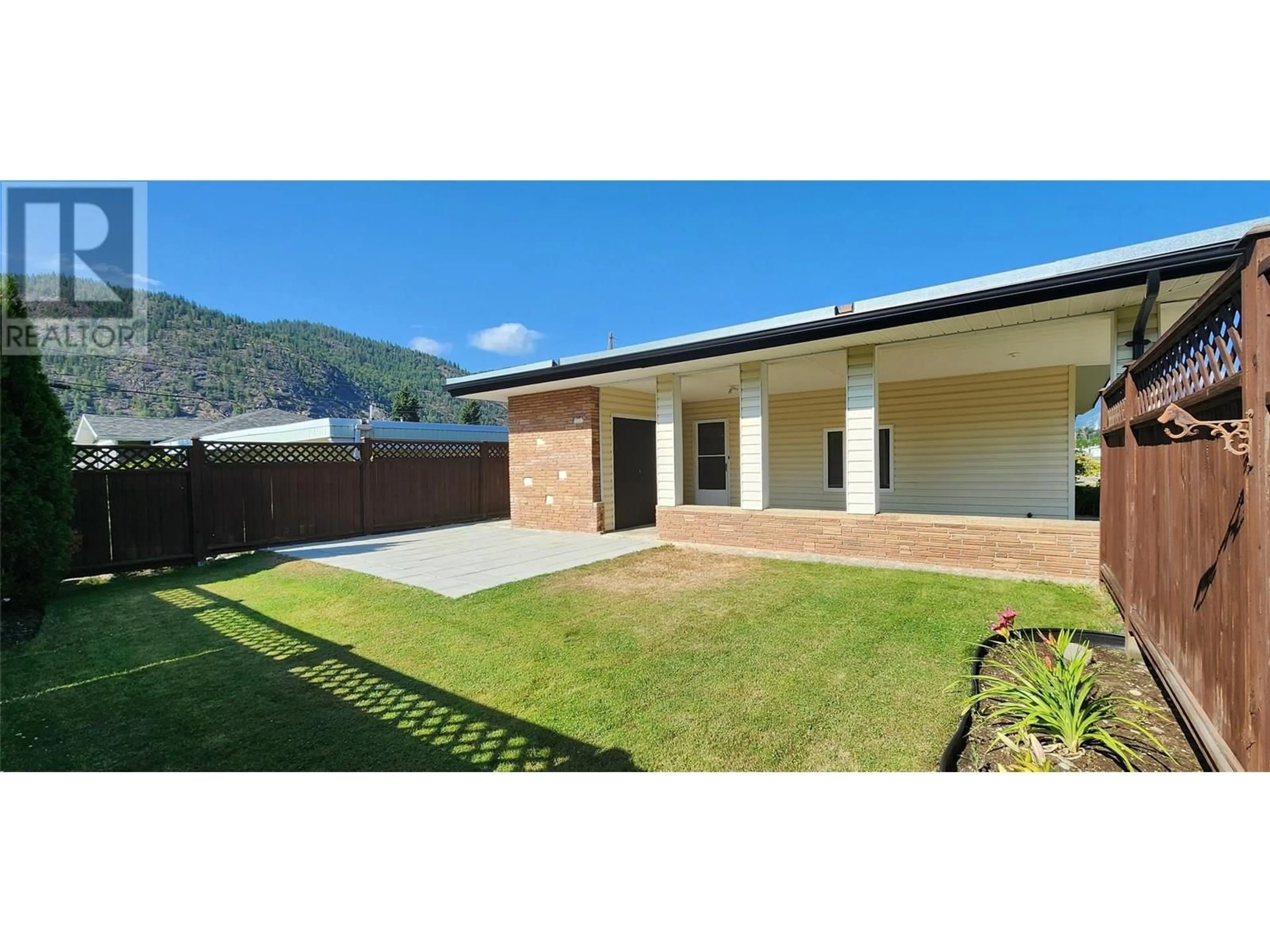 A pic from outside/outdoor area/front of a property/back of a property/a pic from drone, mountain view for 3494 ASTER DRIVE, Trail British Columbia V1R2X3