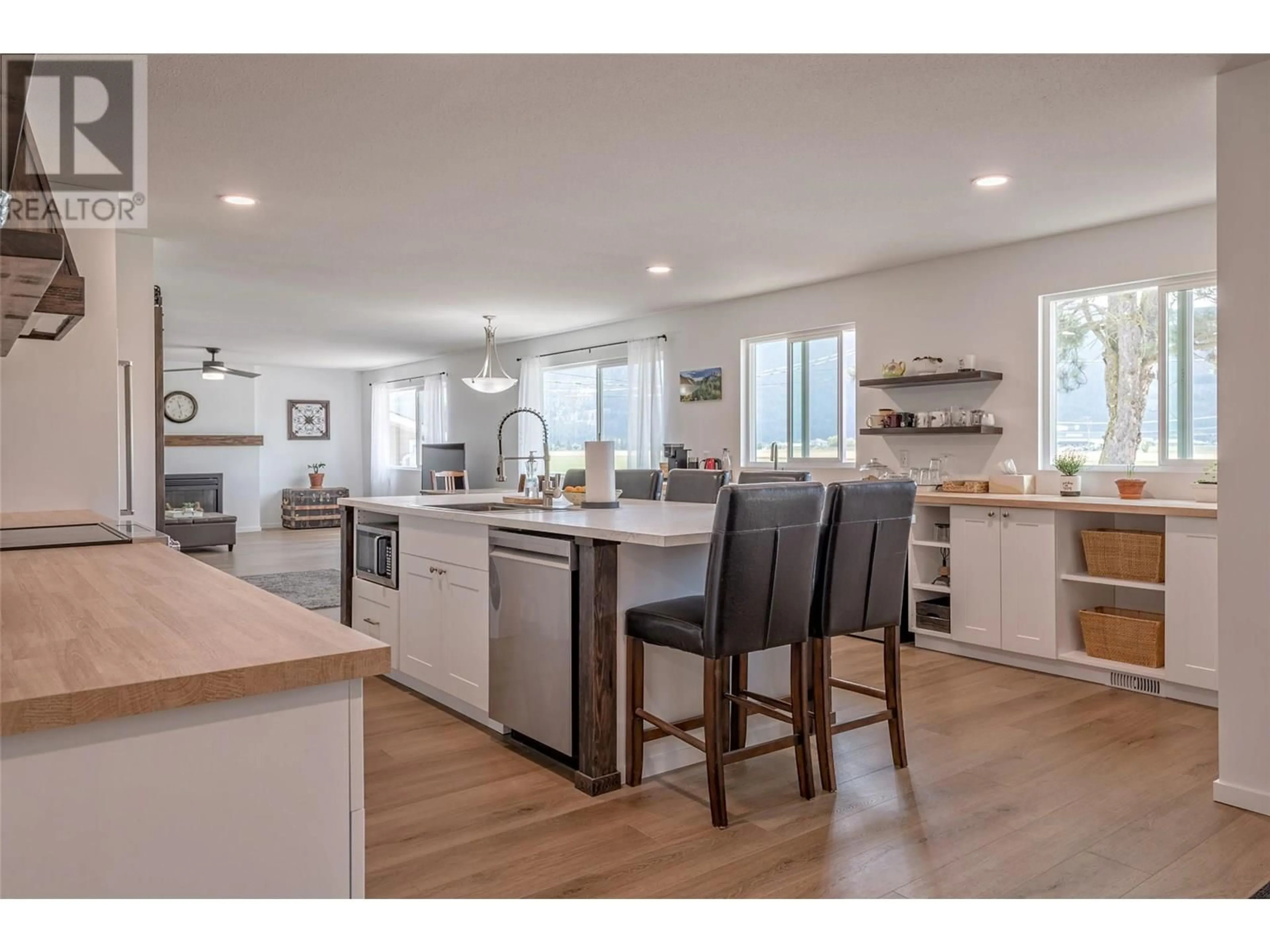 Open concept kitchen, wood/laminate floor for 3470 COLONY AVENUE, Armstrong British Columbia V0E1B2