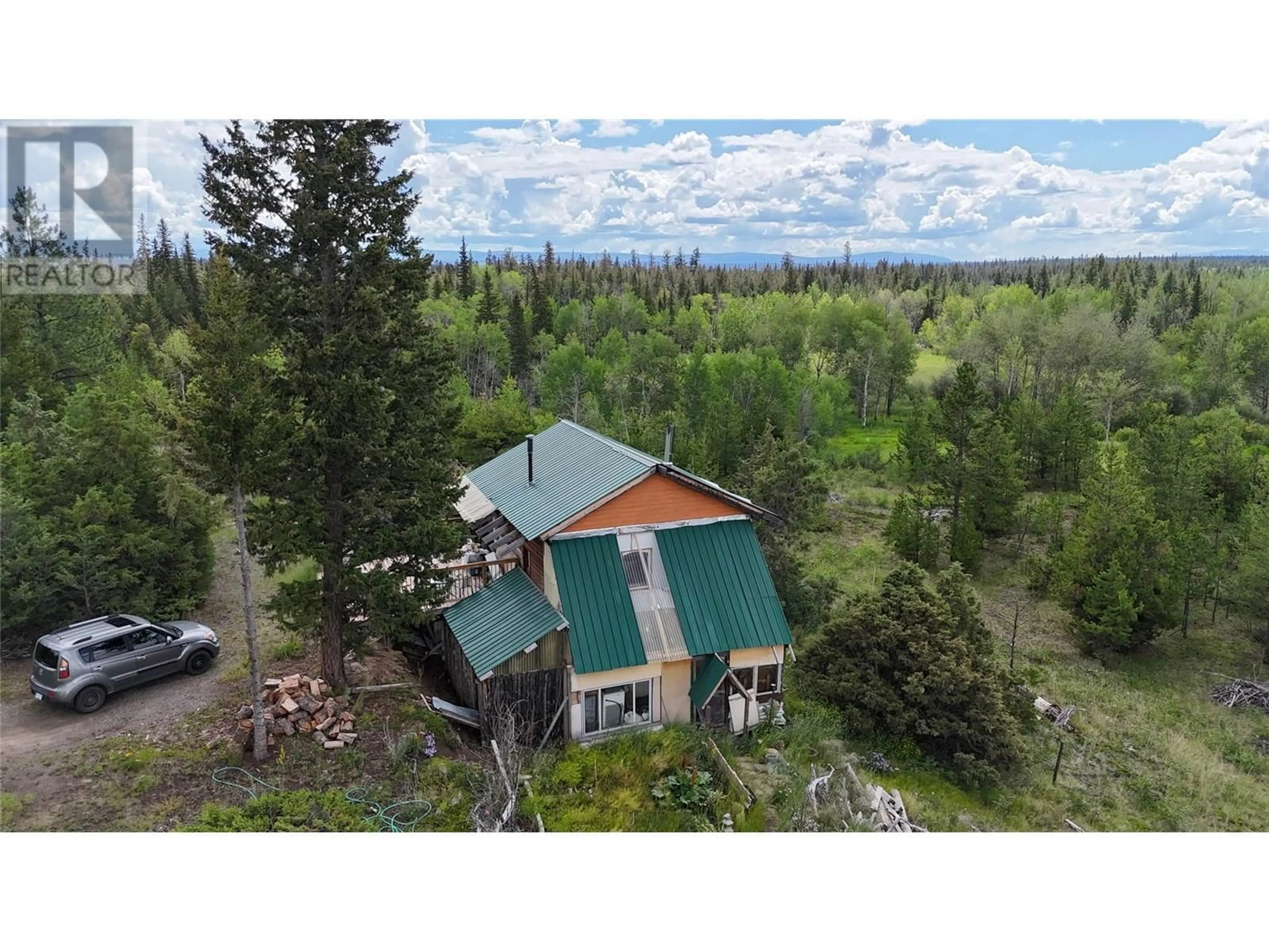 A pic from outside/outdoor area/front of a property/back of a property/a pic from drone, forest/trees view for 1400 CHASM ROAD, 70 Mile House British Columbia V0K1K0