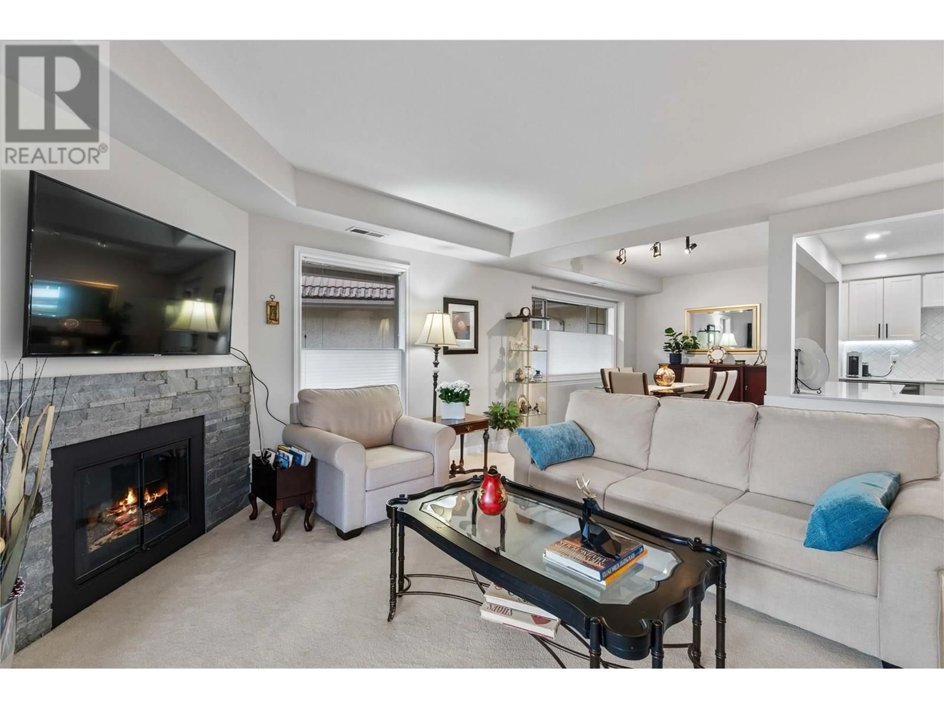 Living room with furniture, unknown for 213 - 3335 RICHTER STREET, Kelowna British Columbia V1W3Y1