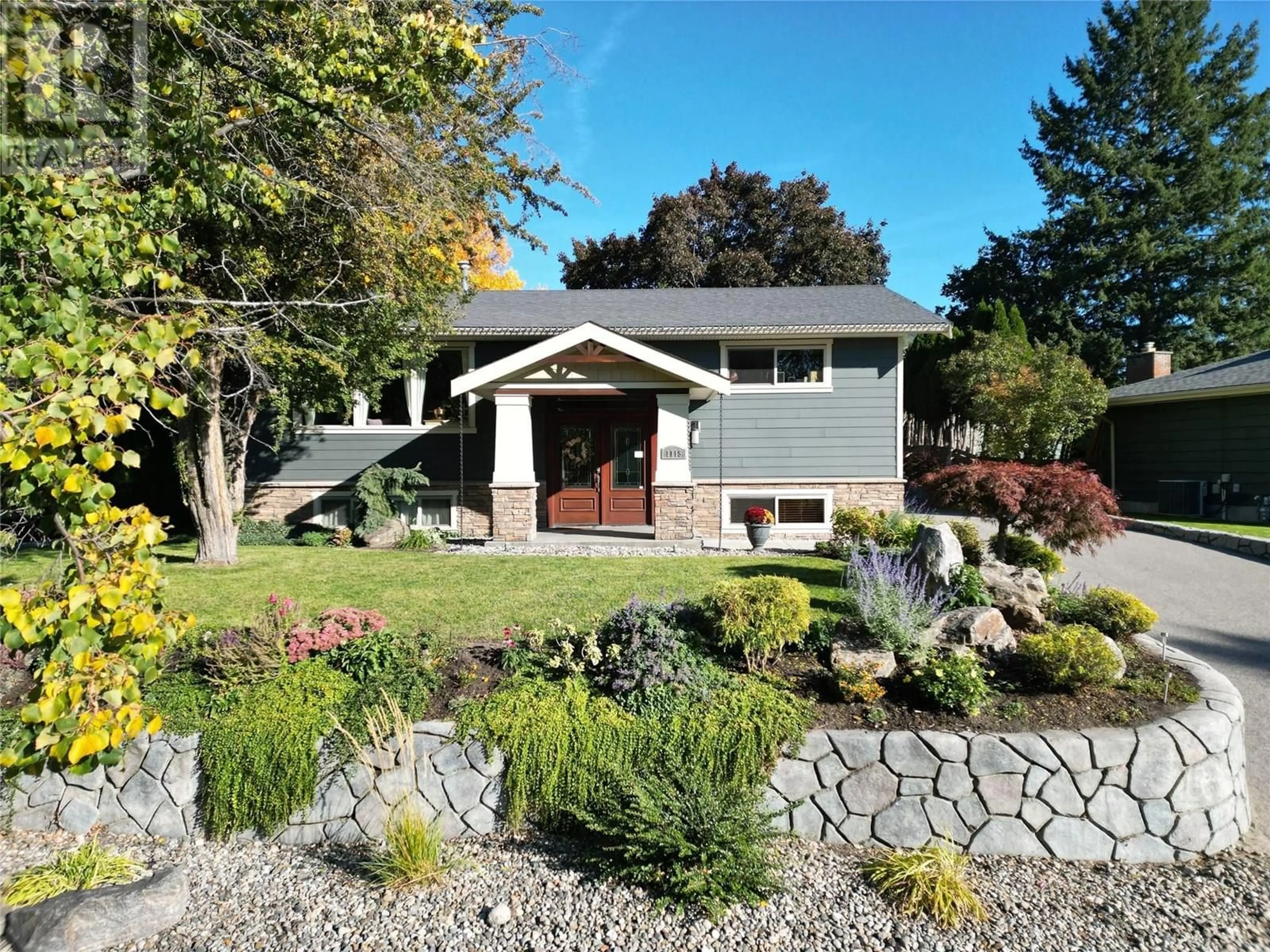 Home with vinyl exterior material, street for 1115 PINECREST LANE, Kelowna British Columbia V1Y4L4