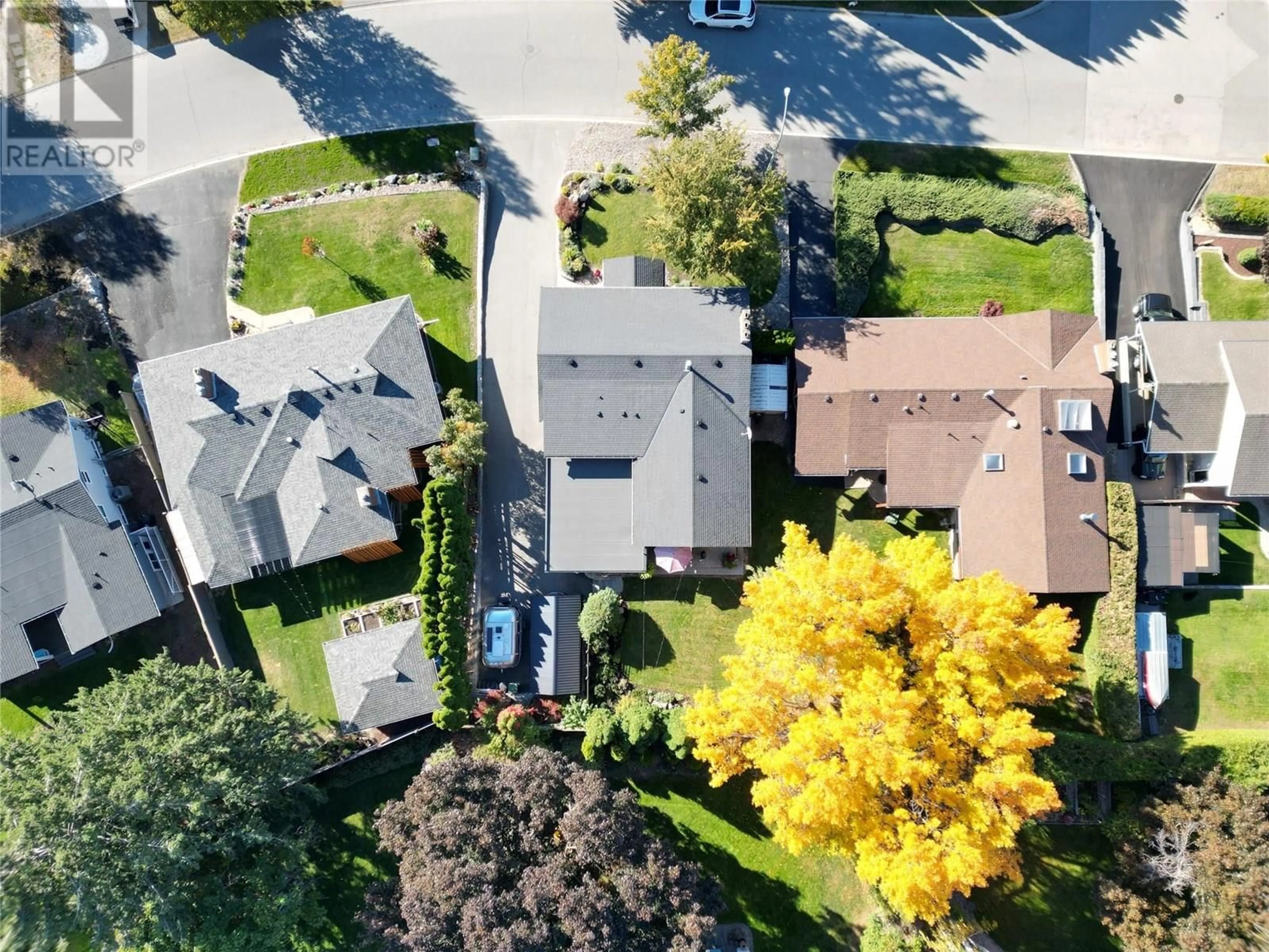 A pic from outside/outdoor area/front of a property/back of a property/a pic from drone, street for 1115 PINECREST LANE, Kelowna British Columbia V1Y4L4