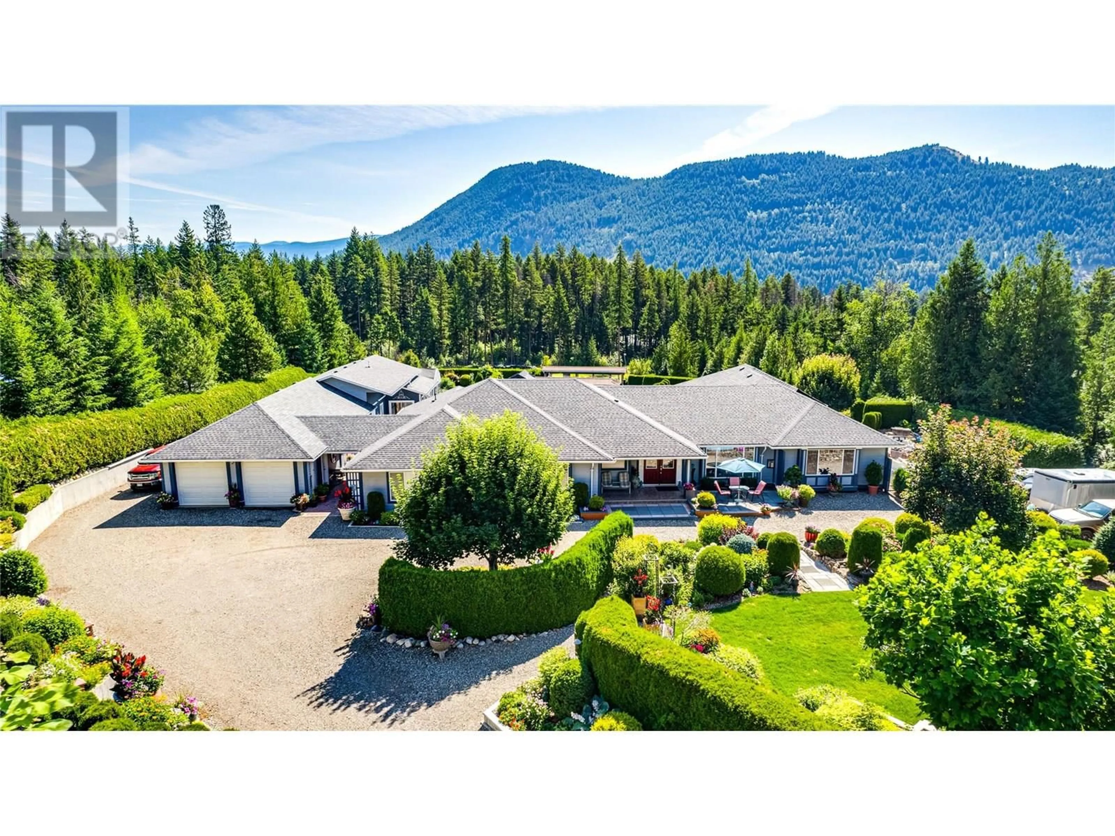 A pic from outside/outdoor area/front of a property/back of a property/a pic from drone, mountain view for 39 LADYSLIPPER ROAD, Lumby British Columbia V0E2G5