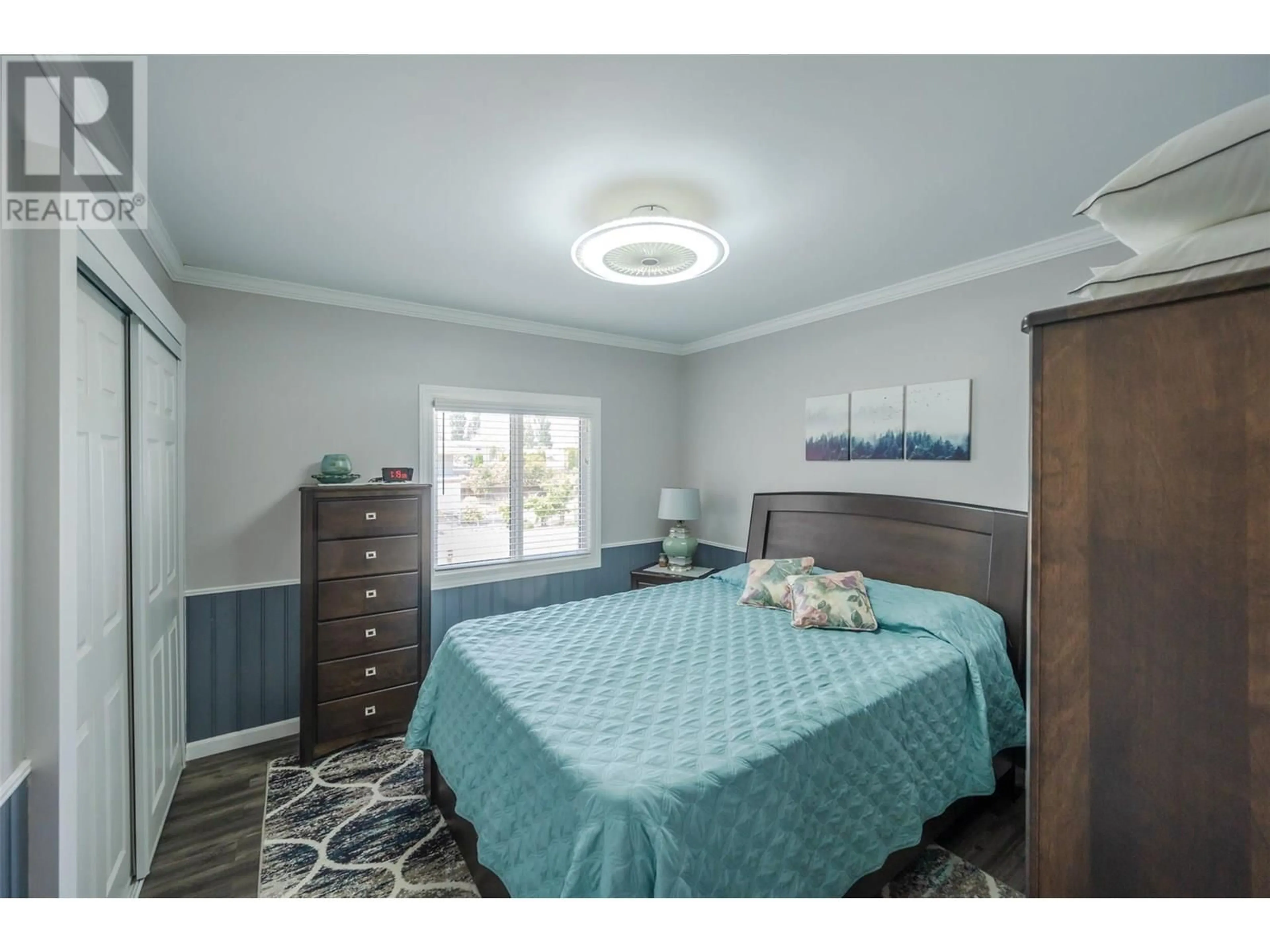 Bedroom with bed, wood/laminate floor for 6018 MAPLE DRIVE, Osoyoos British Columbia V0H1V3
