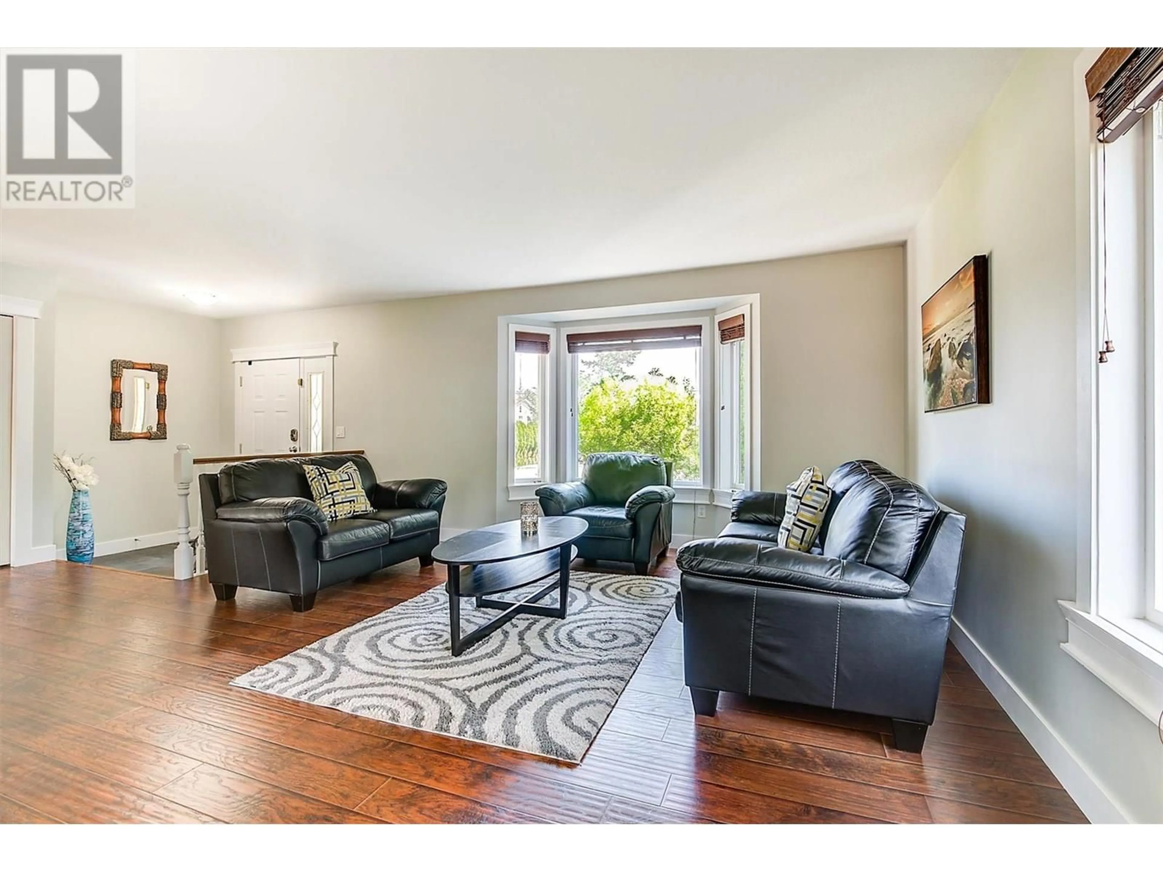 Living room with furniture, wood/laminate floor for 3236 STONEGATE COURT, West Kelowna British Columbia V4T1A7