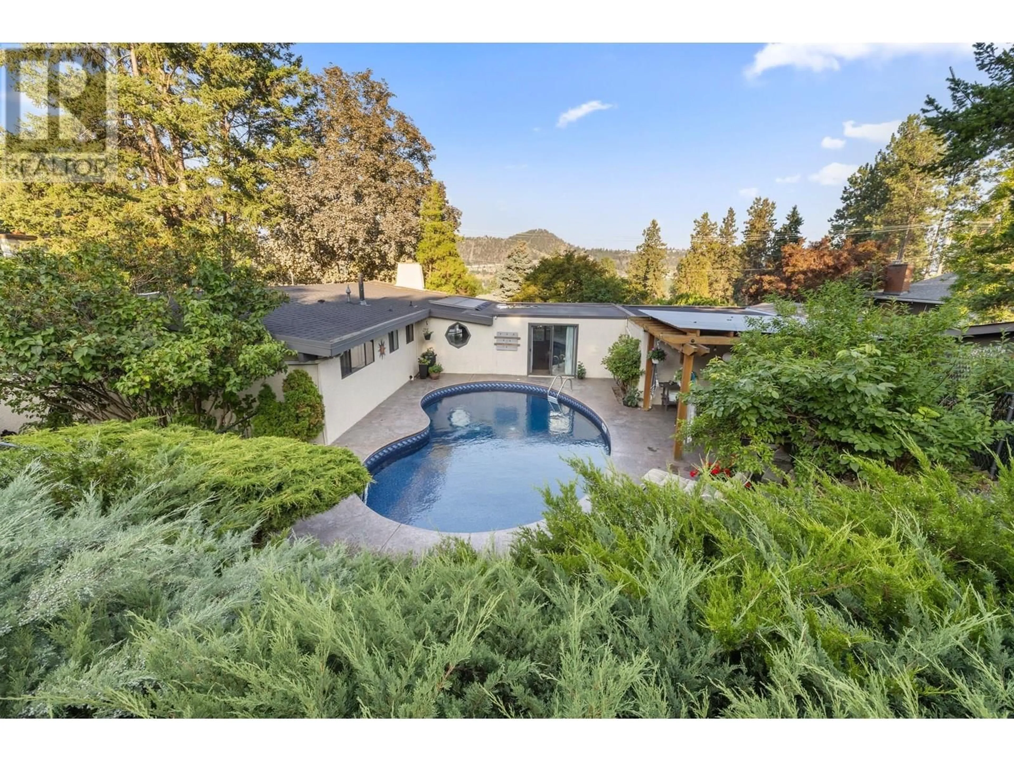 A pic from outside/outdoor area/front of a property/back of a property/a pic from drone, mountain view for 48 CARAMILLO ROAD, Kelowna British Columbia V1V1B3