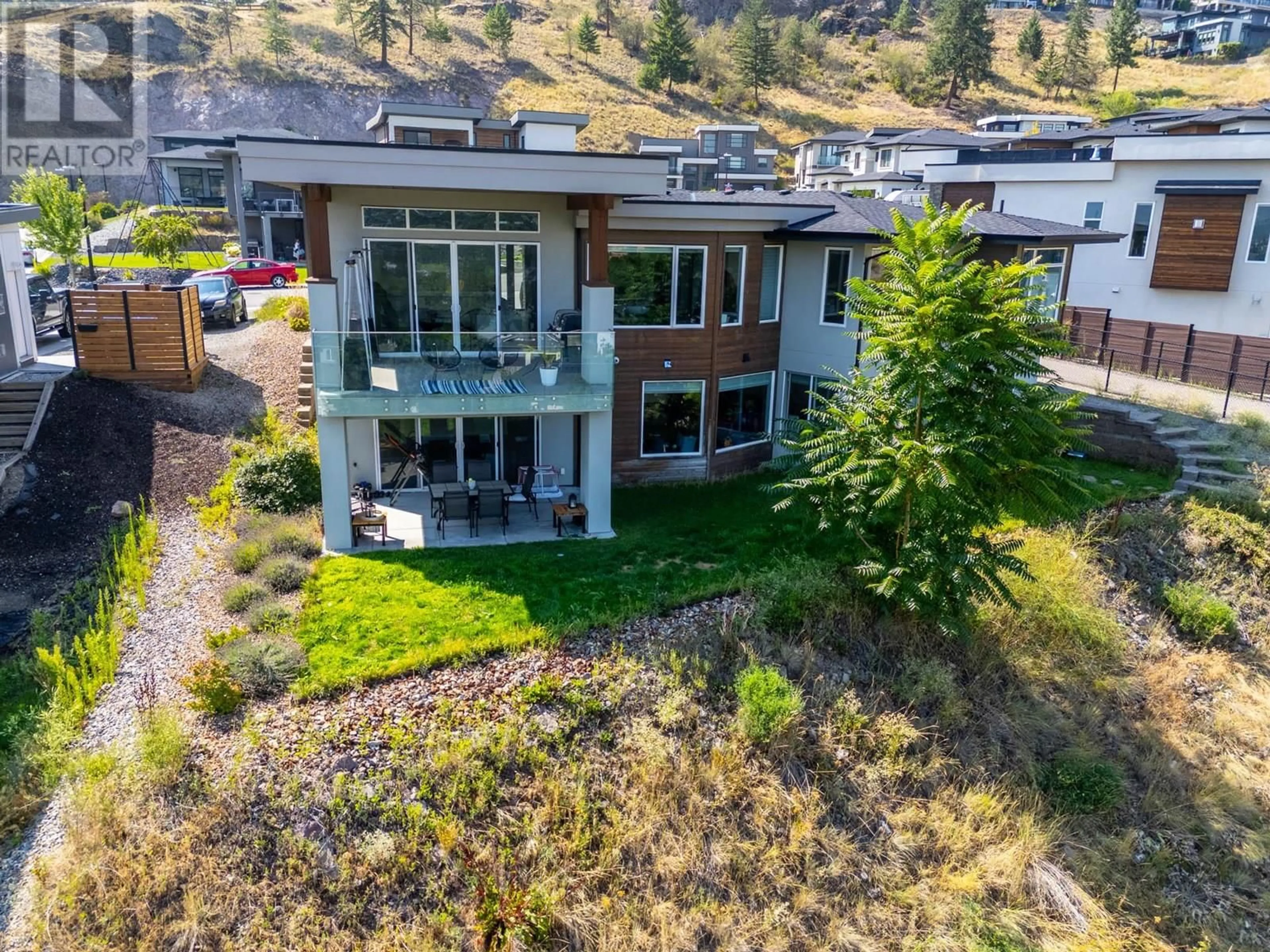 A pic from outside/outdoor area/front of a property/back of a property/a pic from drone, mountain view for 1341 SLADEN CRESCENT, Kelowna British Columbia V1V2Y1