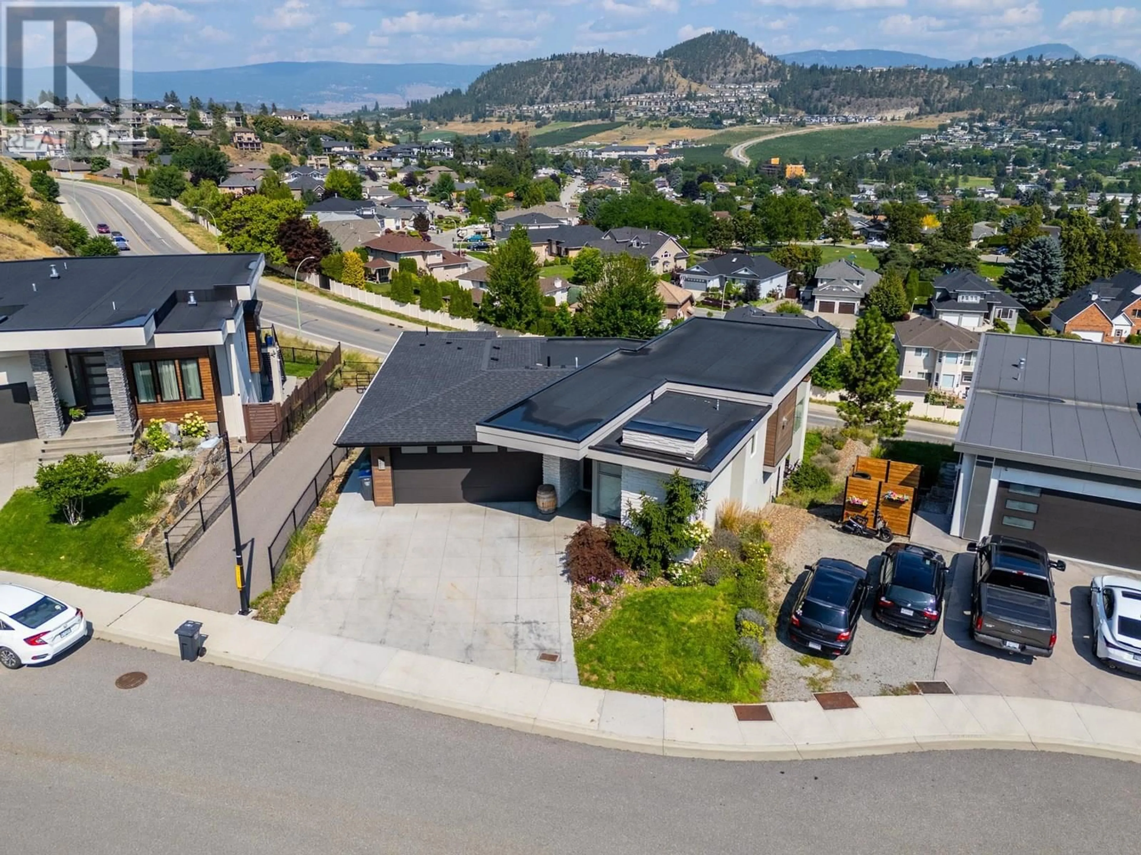 A pic from outside/outdoor area/front of a property/back of a property/a pic from drone, street for 1341 SLADEN CRESCENT, Kelowna British Columbia V1V2Y1