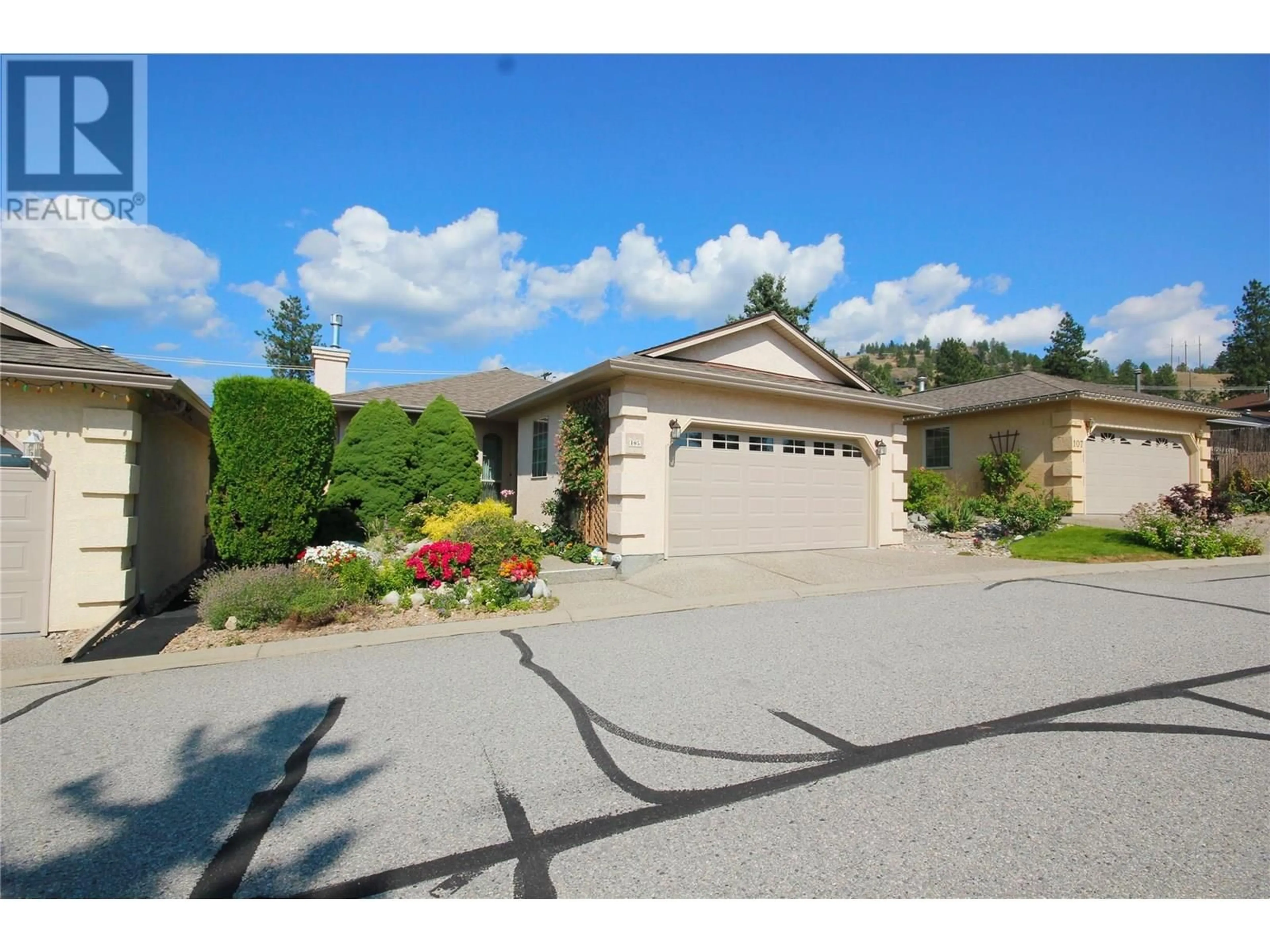 A pic from outside/outdoor area/front of a property/back of a property/a pic from drone, street for 105 - 1634 CARMI AVENUE, Penticton British Columbia V2A8K5