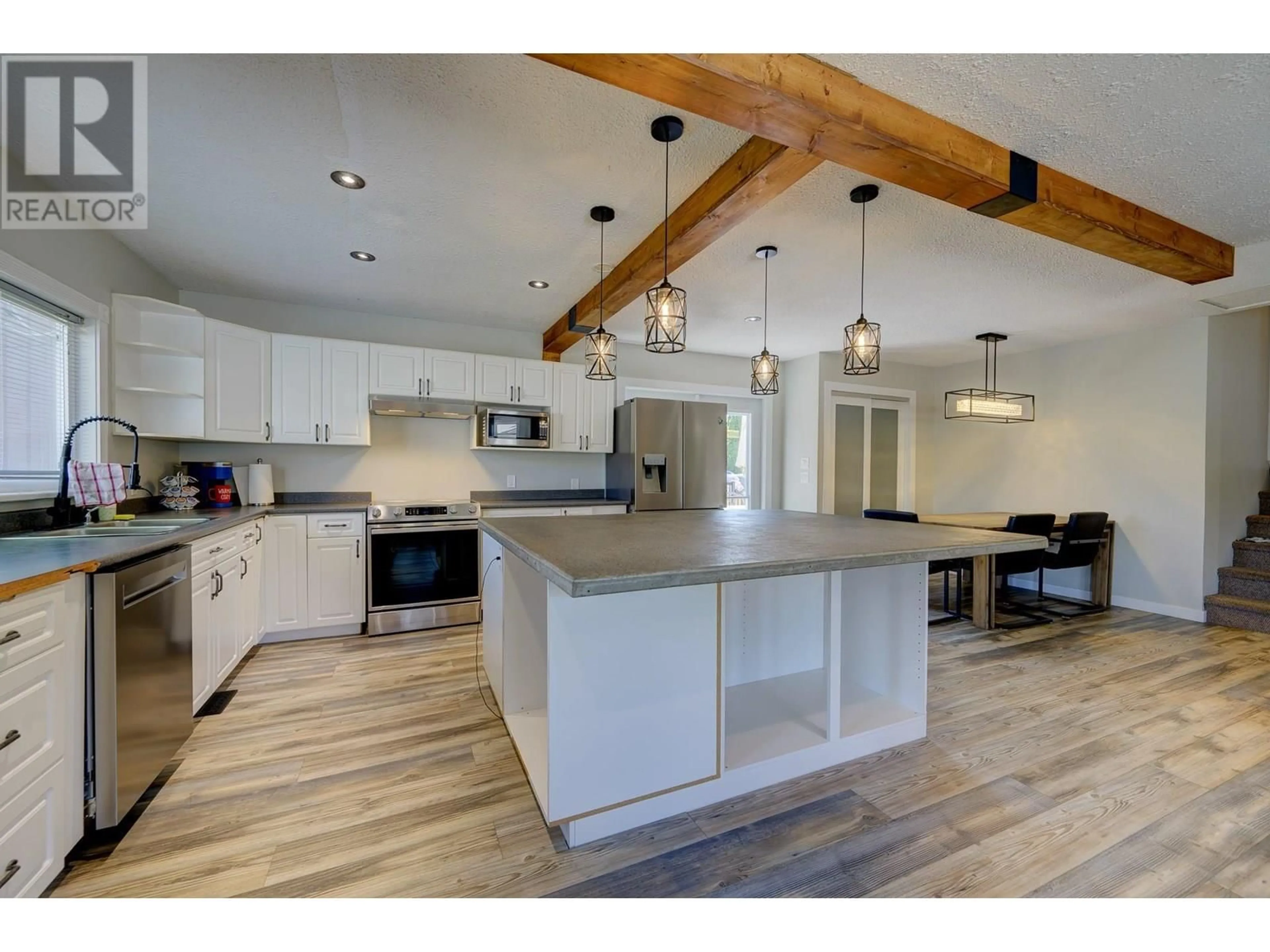 Open concept kitchen, wood/laminate floor for 2505 SANDALWOOD DRIVE, Kamloops British Columbia V2B6V3