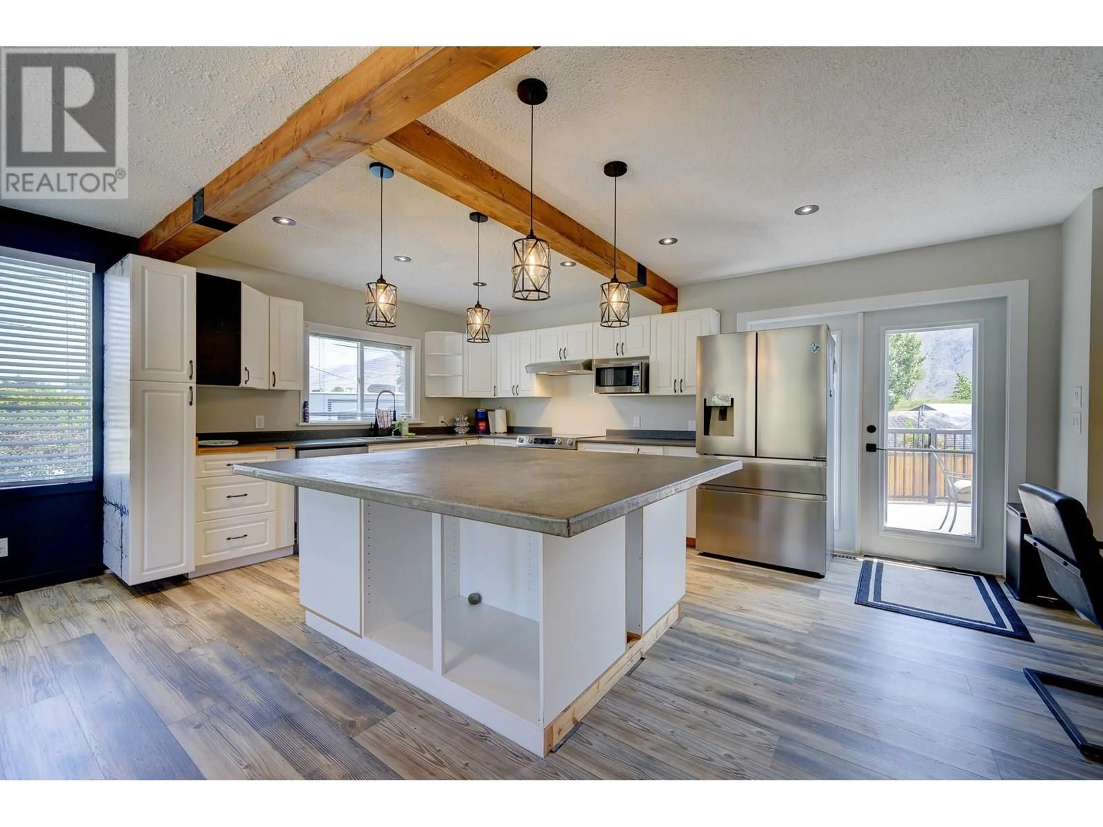 Open concept kitchen, wood/laminate floor for 2505 SANDALWOOD DRIVE, Kamloops British Columbia V2B6V3