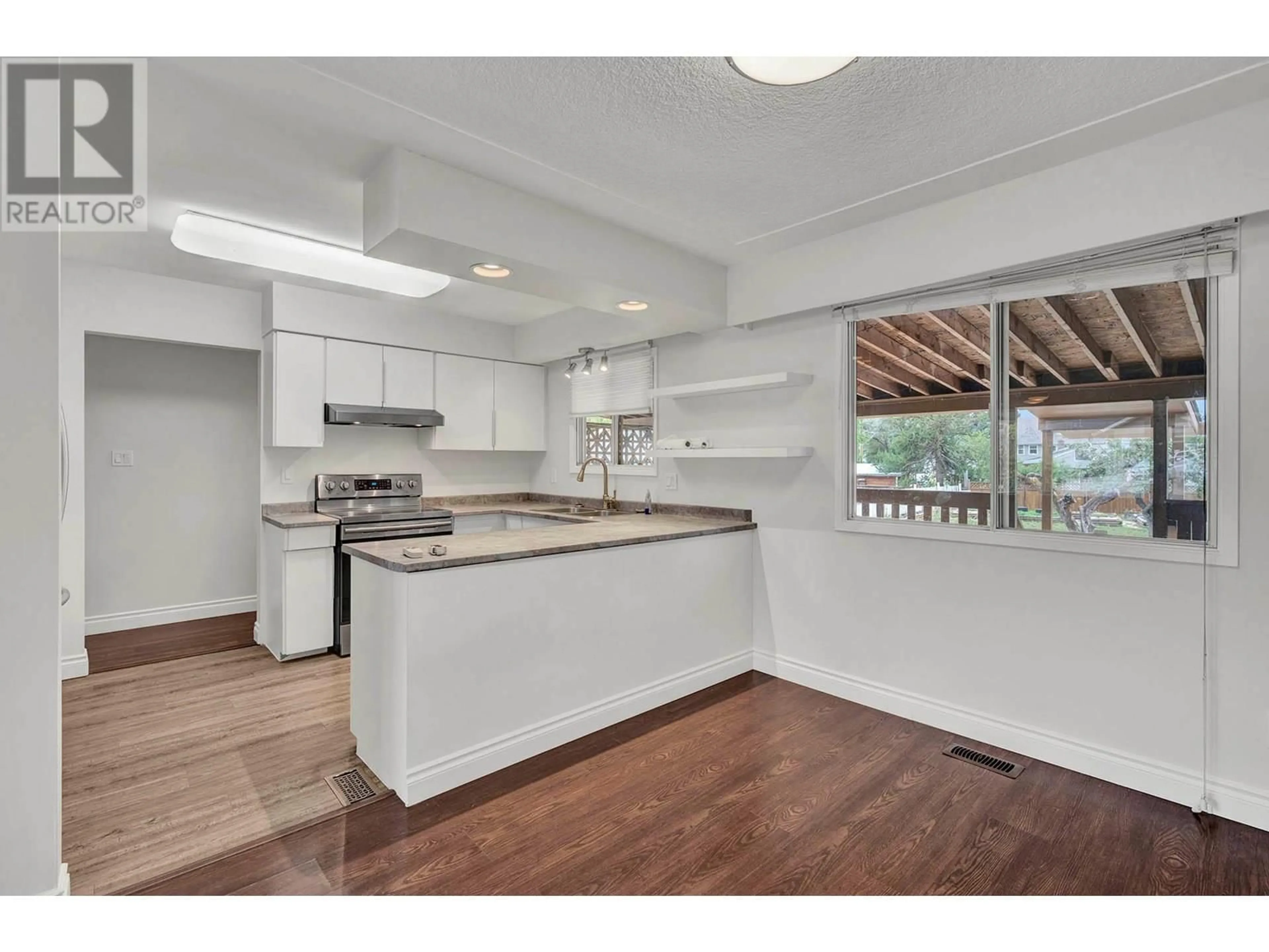 Open concept kitchen, wood/laminate floor for 747 LYNE ROAD, Kamloops British Columbia V2B6N9