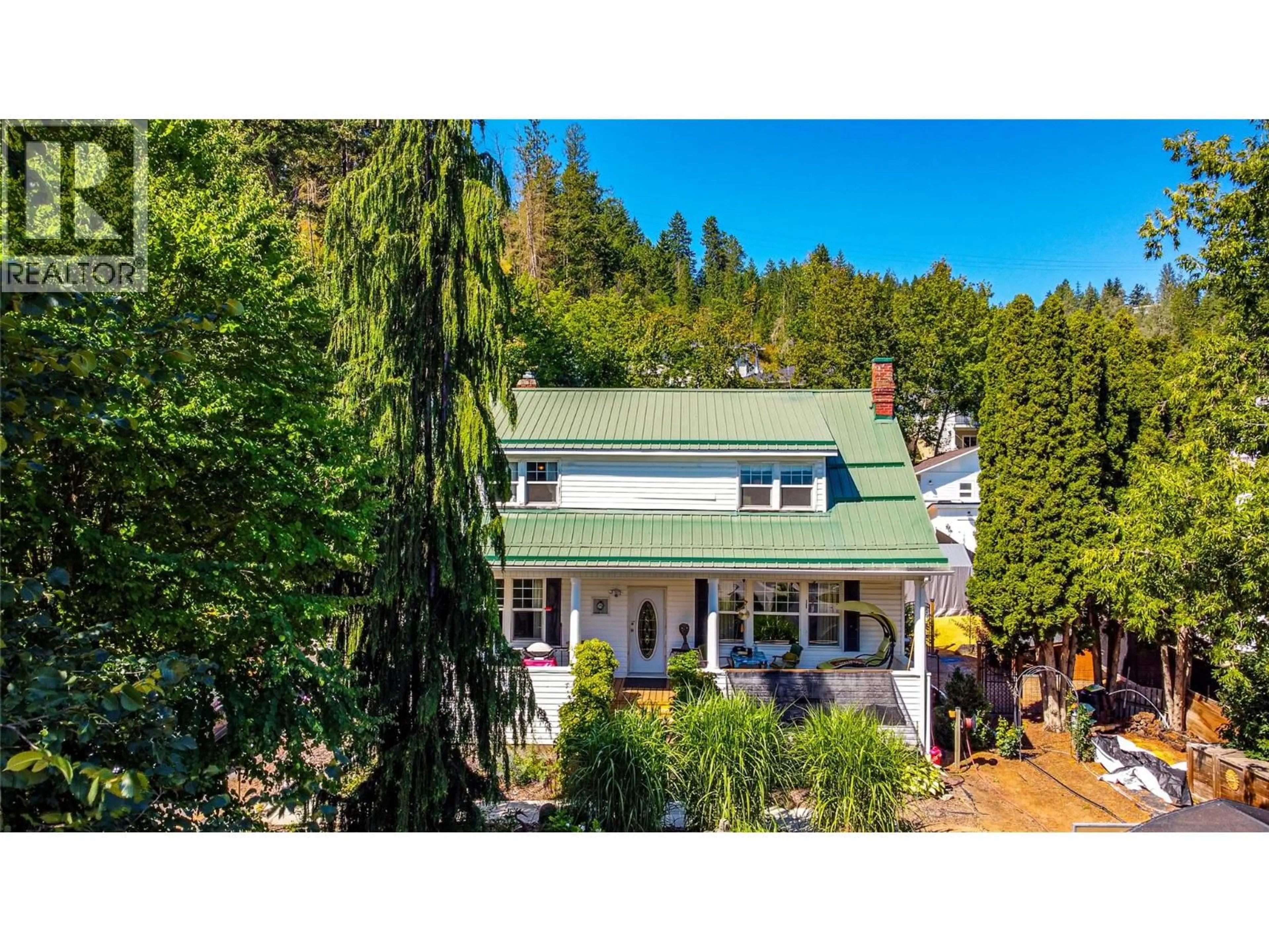 A pic from outside/outdoor area/front of a property/back of a property/a pic from drone, water/lake/river/ocean view for 706 SICAMOUS STREET, Enderby British Columbia V0E1V0
