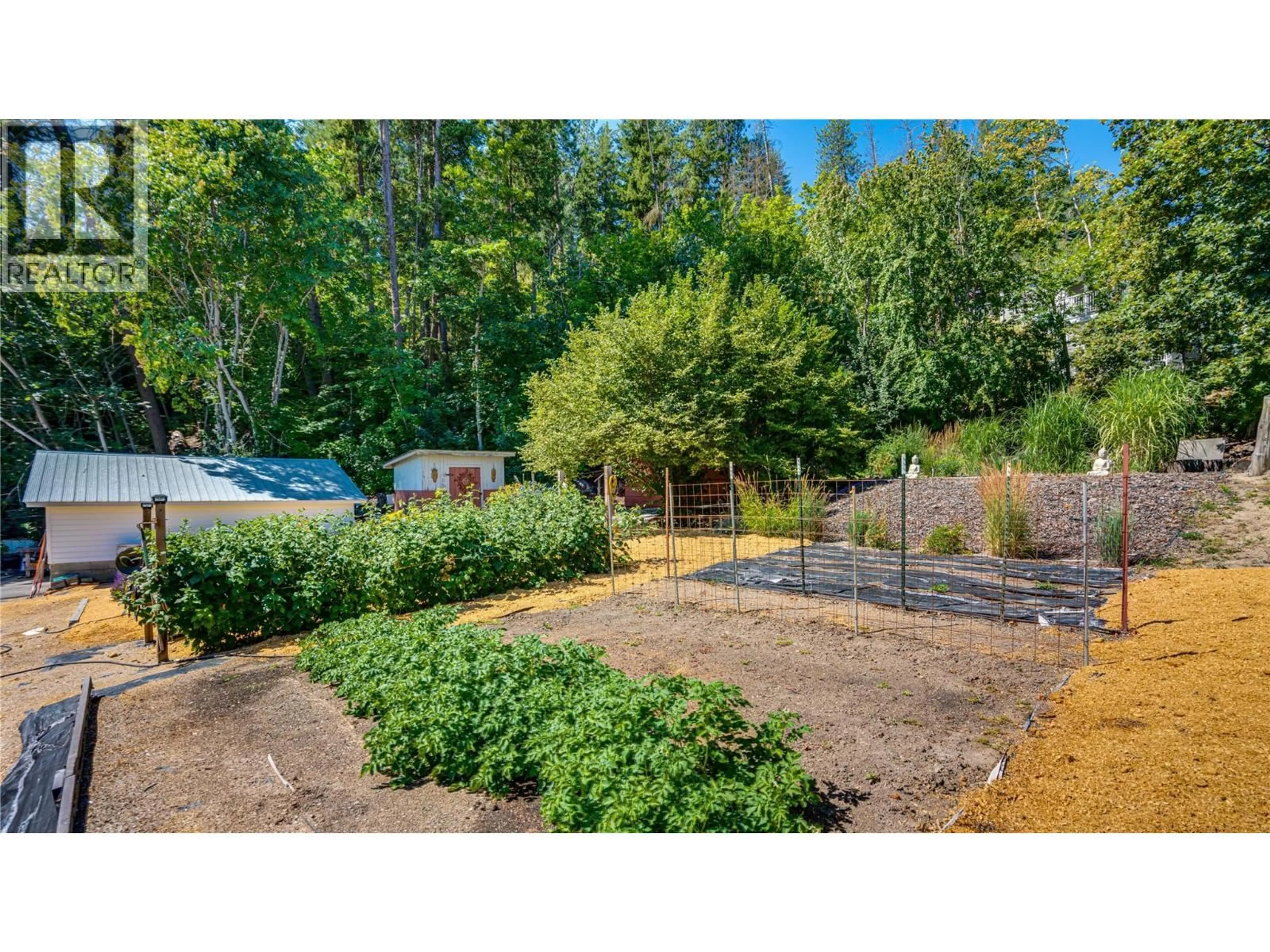 A pic from outside/outdoor area/front of a property/back of a property/a pic from drone, forest/trees view for 706 SICAMOUS STREET, Enderby British Columbia V0E1V0