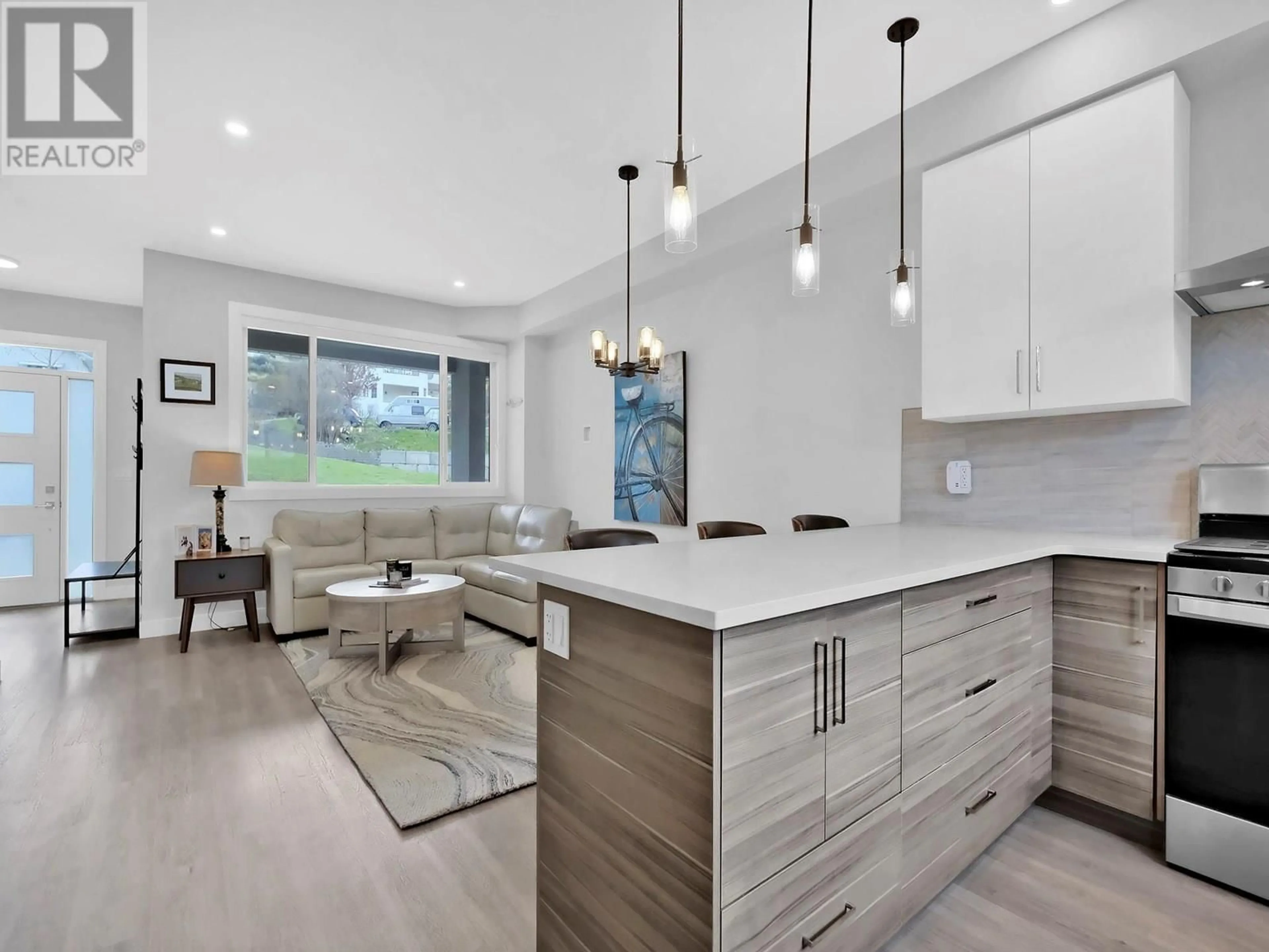 Open concept kitchen, wood/laminate floor for 105 - 253 NORTON STREET, Penticton British Columbia V2A4H8