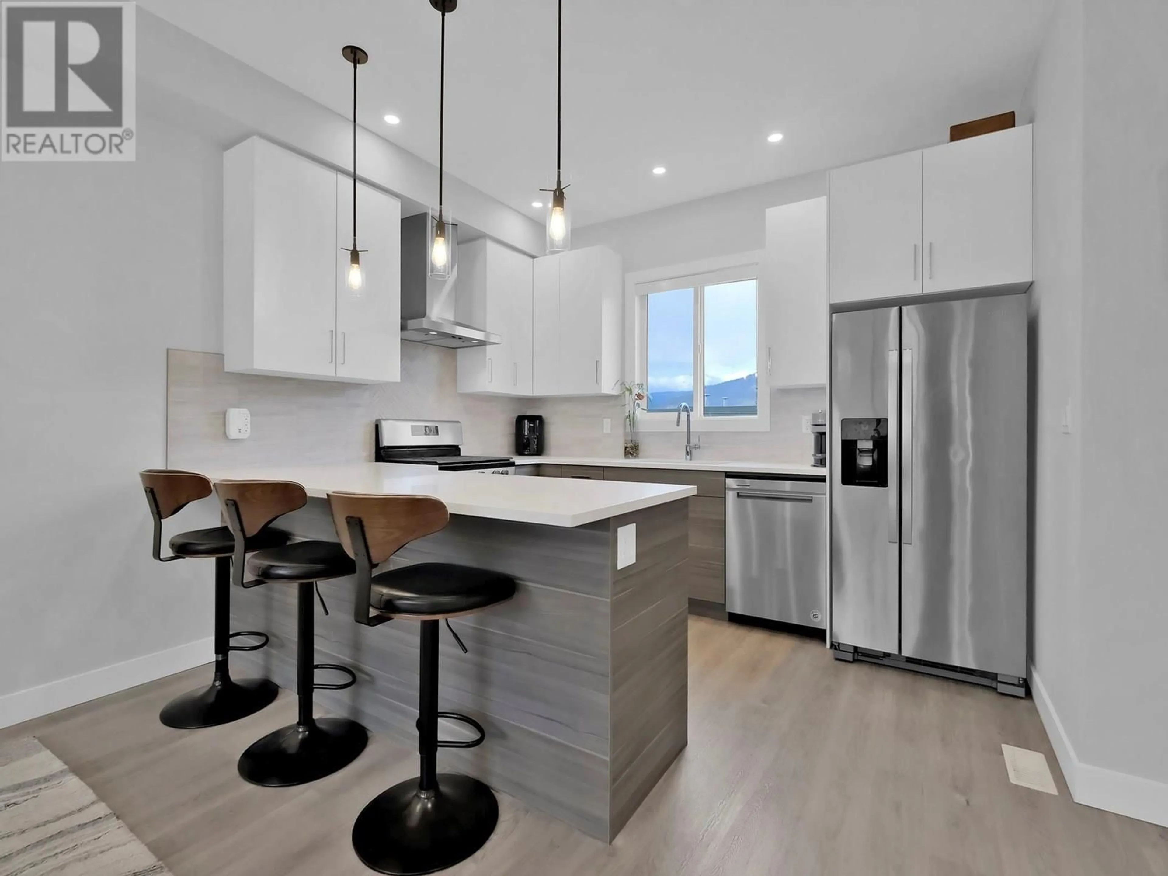 Open concept kitchen, wood/laminate floor for 105 - 253 NORTON STREET, Penticton British Columbia V2A4H8