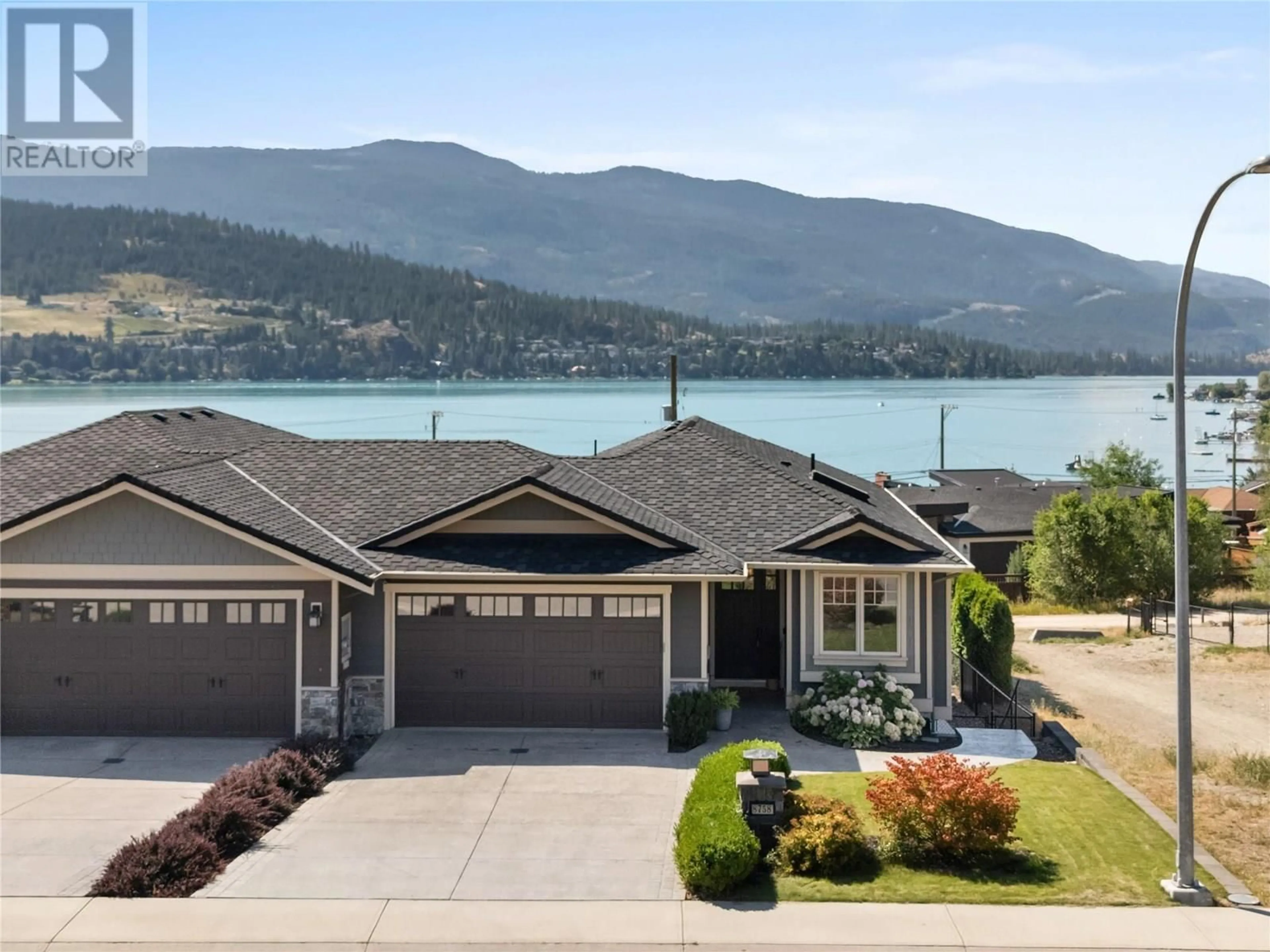 Home with vinyl exterior material, water/lake/river/ocean view for 8758 HOFER DRIVE, Coldstream British Columbia V1B1Y8