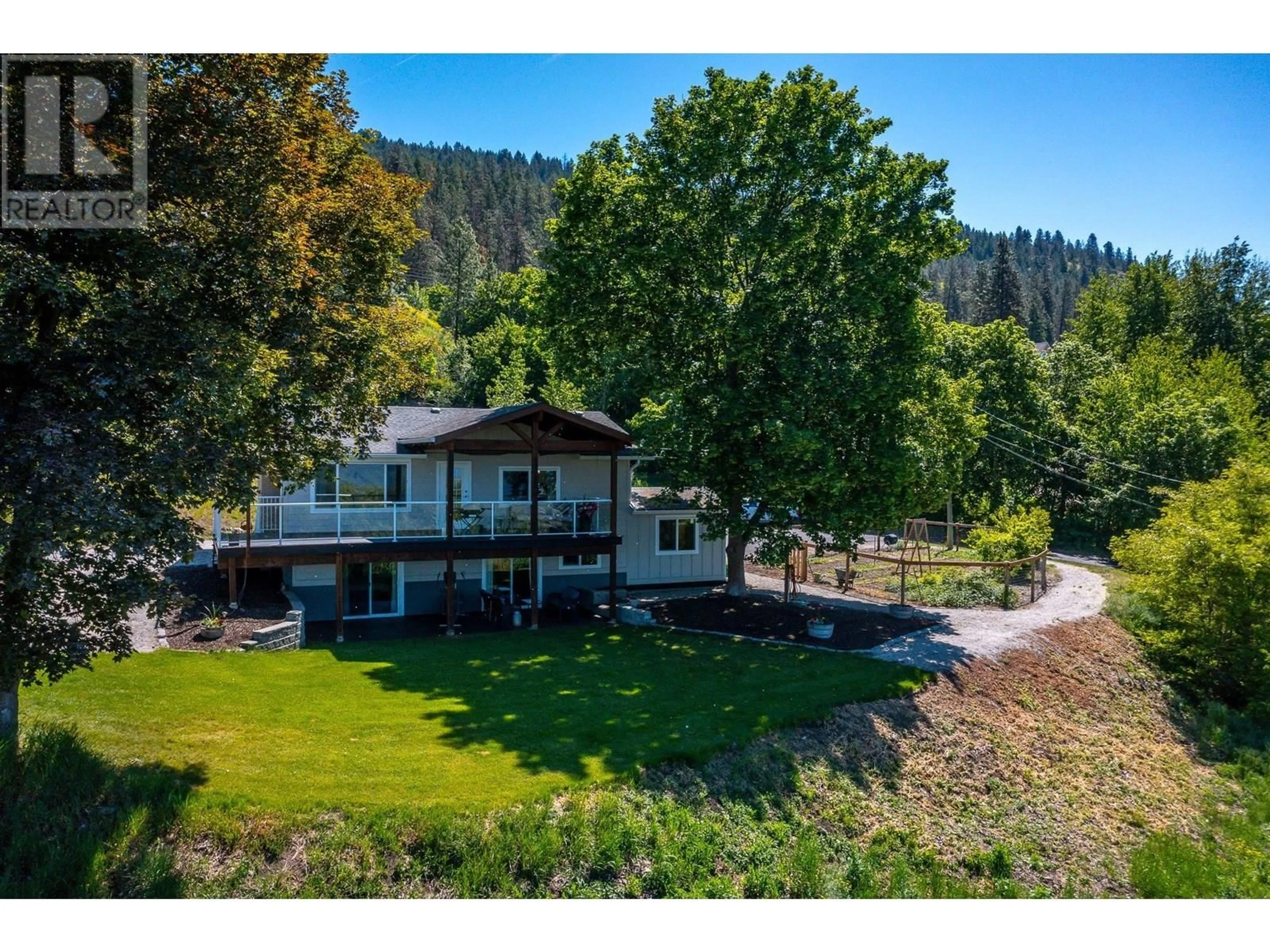 A pic from outside/outdoor area/front of a property/back of a property/a pic from drone, water/lake/river/ocean view for 3253 PHILLIPS ROAD, Vernon British Columbia V1B3H6