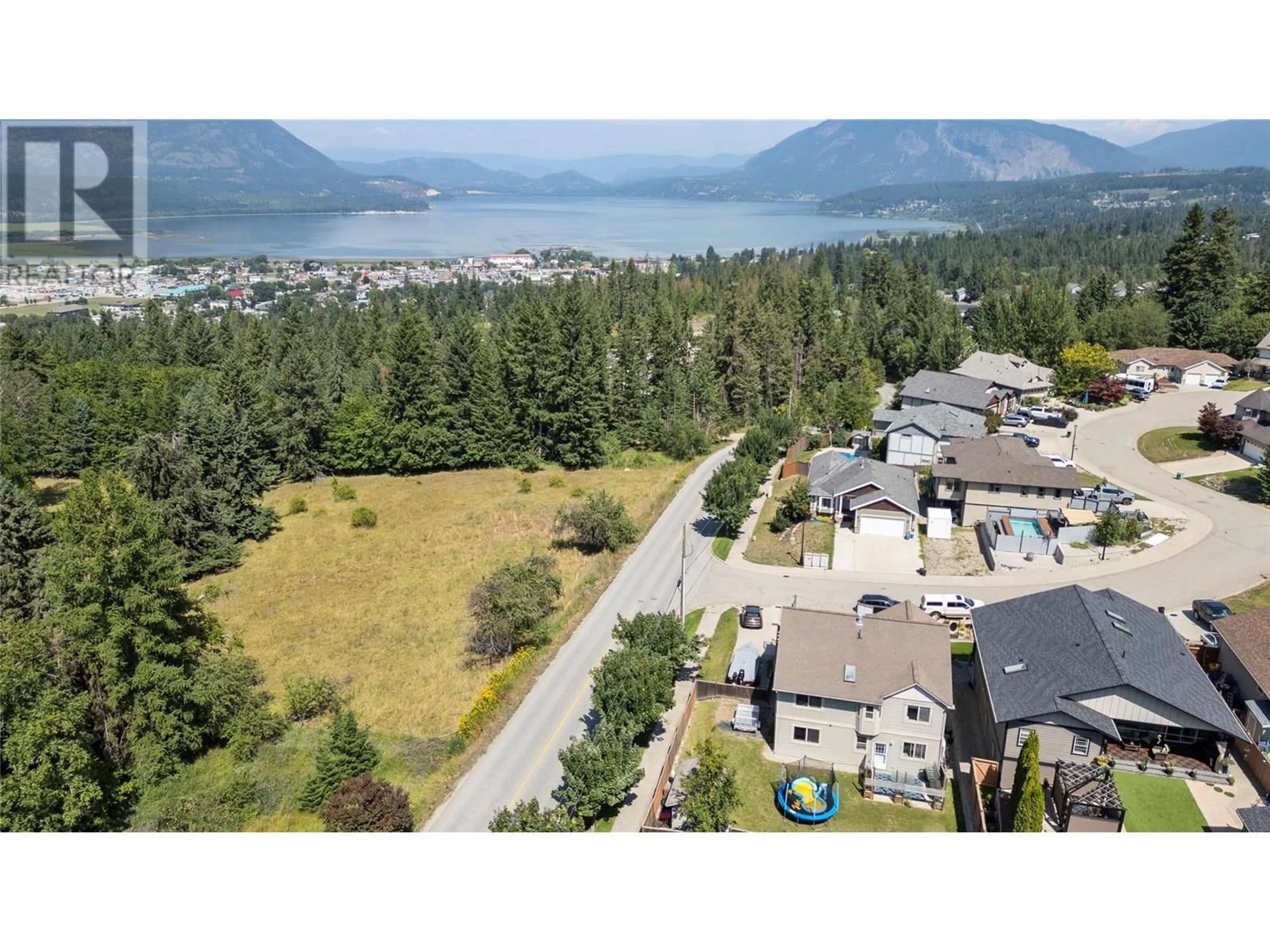 A pic from outside/outdoor area/front of a property/back of a property/a pic from drone, mountain view for 1002 14 AVENUE SOUTHEAST, Salmon Arm British Columbia V1E2R5