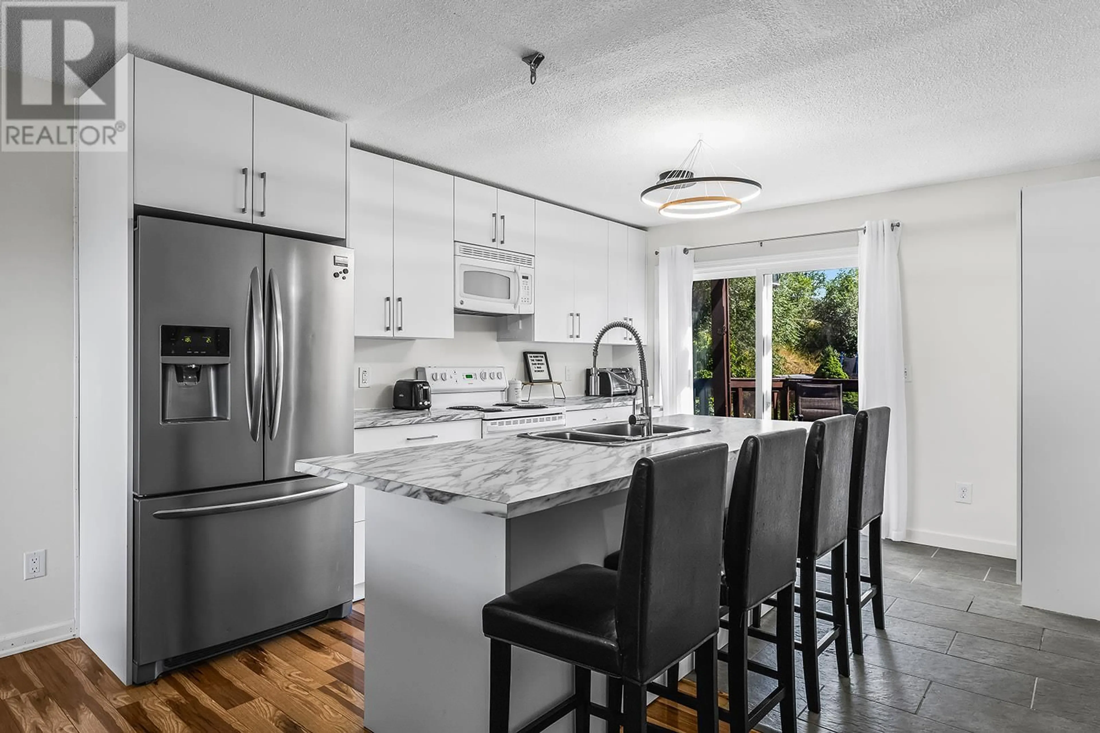Open concept kitchen, ceramic/tile floor for 675 WEBSTER ROAD, Kelowna British Columbia V1X4V6