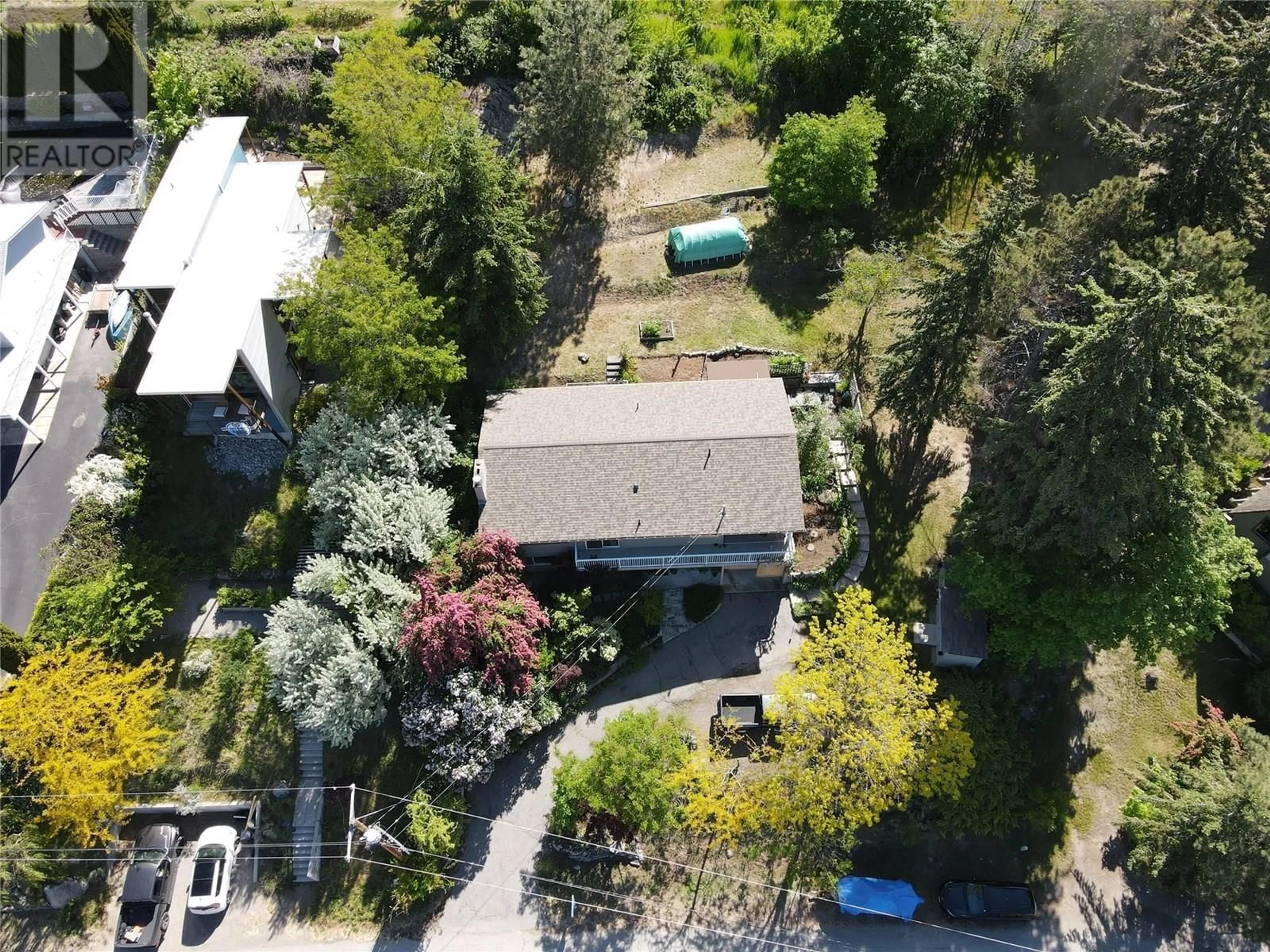 A pic from outside/outdoor area/front of a property/back of a property/a pic from drone, street for 3812 ALBRECHT ROAD, Penticton British Columbia V0H1N0