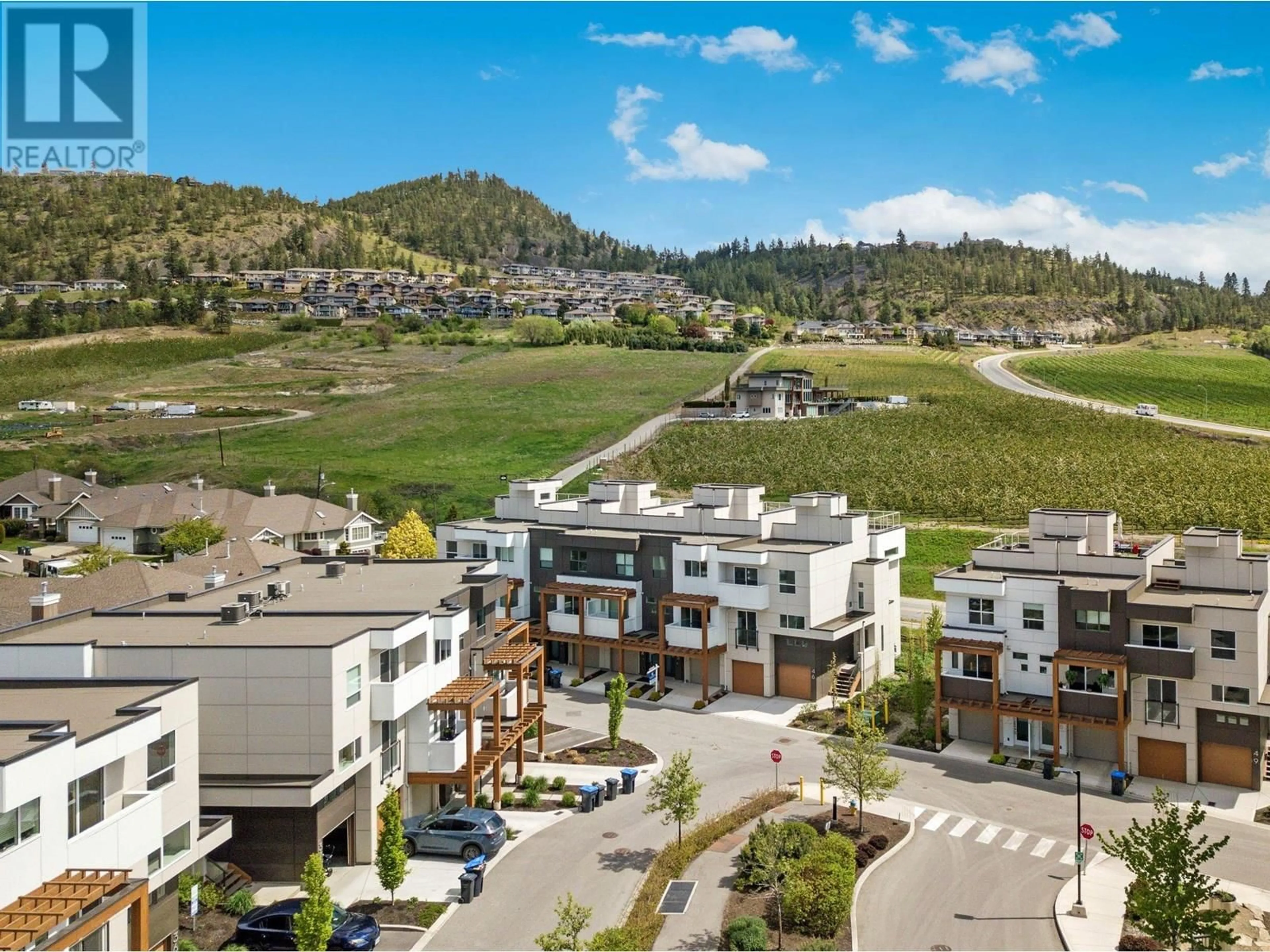 A pic from outside/outdoor area/front of a property/back of a property/a pic from drone, mountain view for 43 - 720 VALLEY ROAD, Kelowna British Columbia V1V0E1