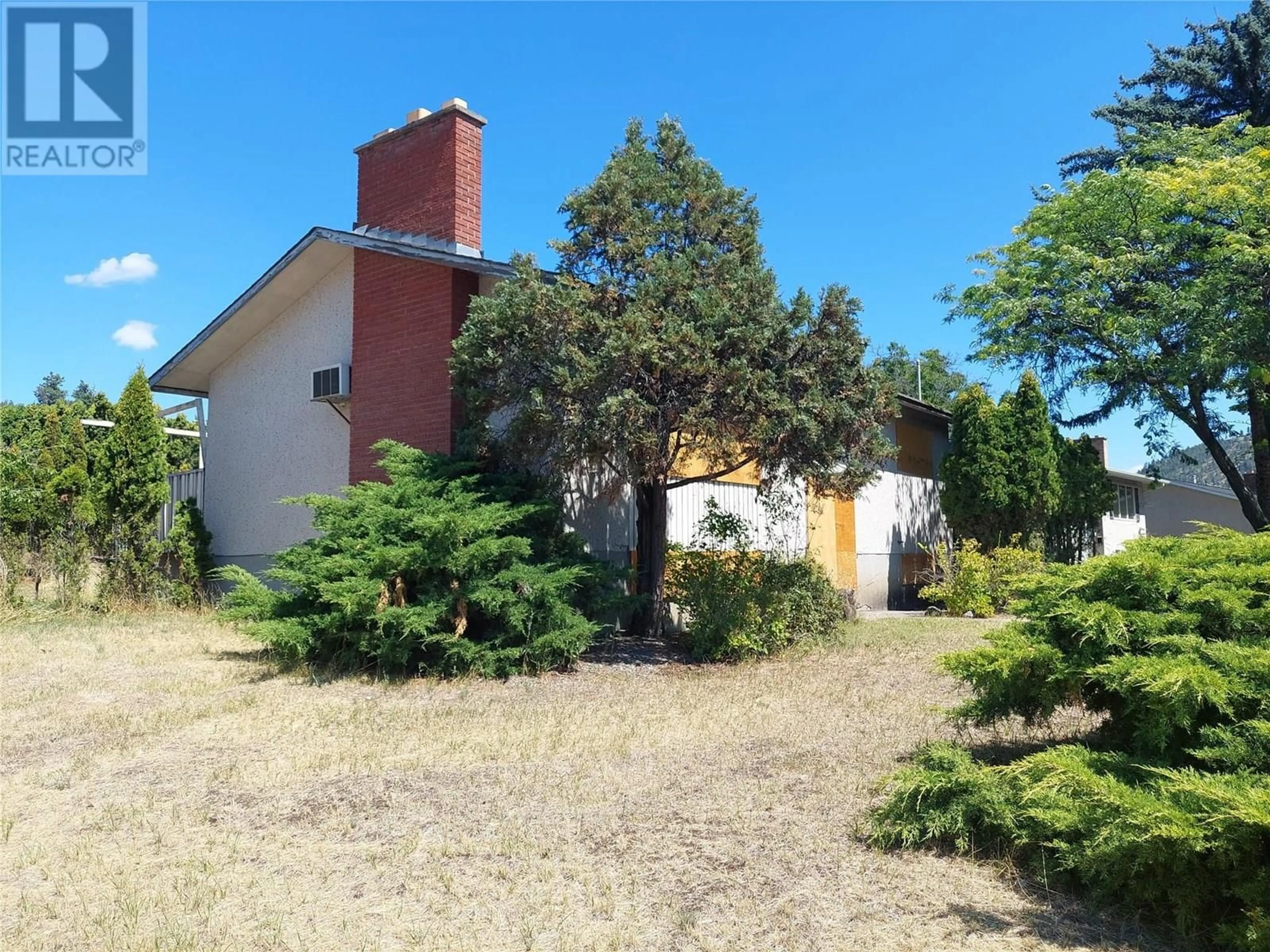 A pic from outside/outdoor area/front of a property/back of a property/a pic from drone, street for 1706 HIGH ROAD, Kelowna British Columbia V1Y7C1