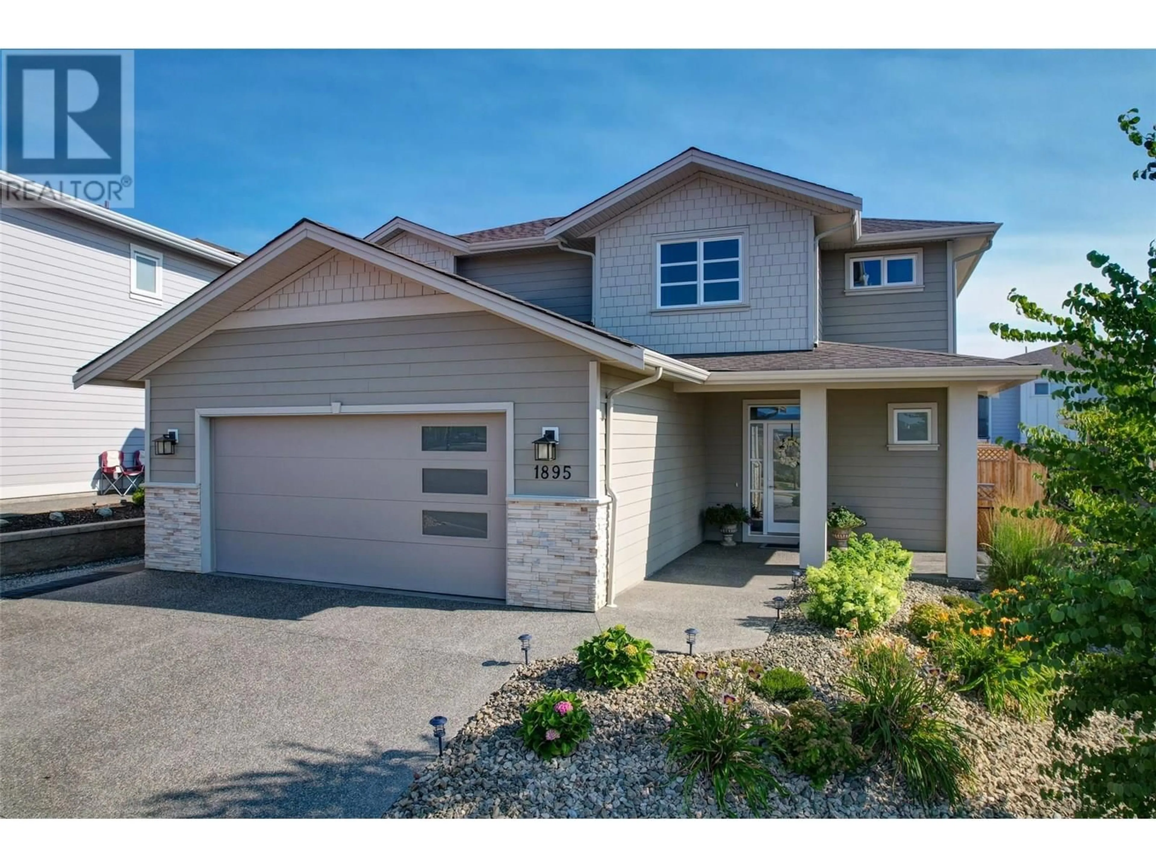 Home with vinyl exterior material, street for 1895 FOXTAIL TERRACE, Kelowna British Columbia V1P1T9