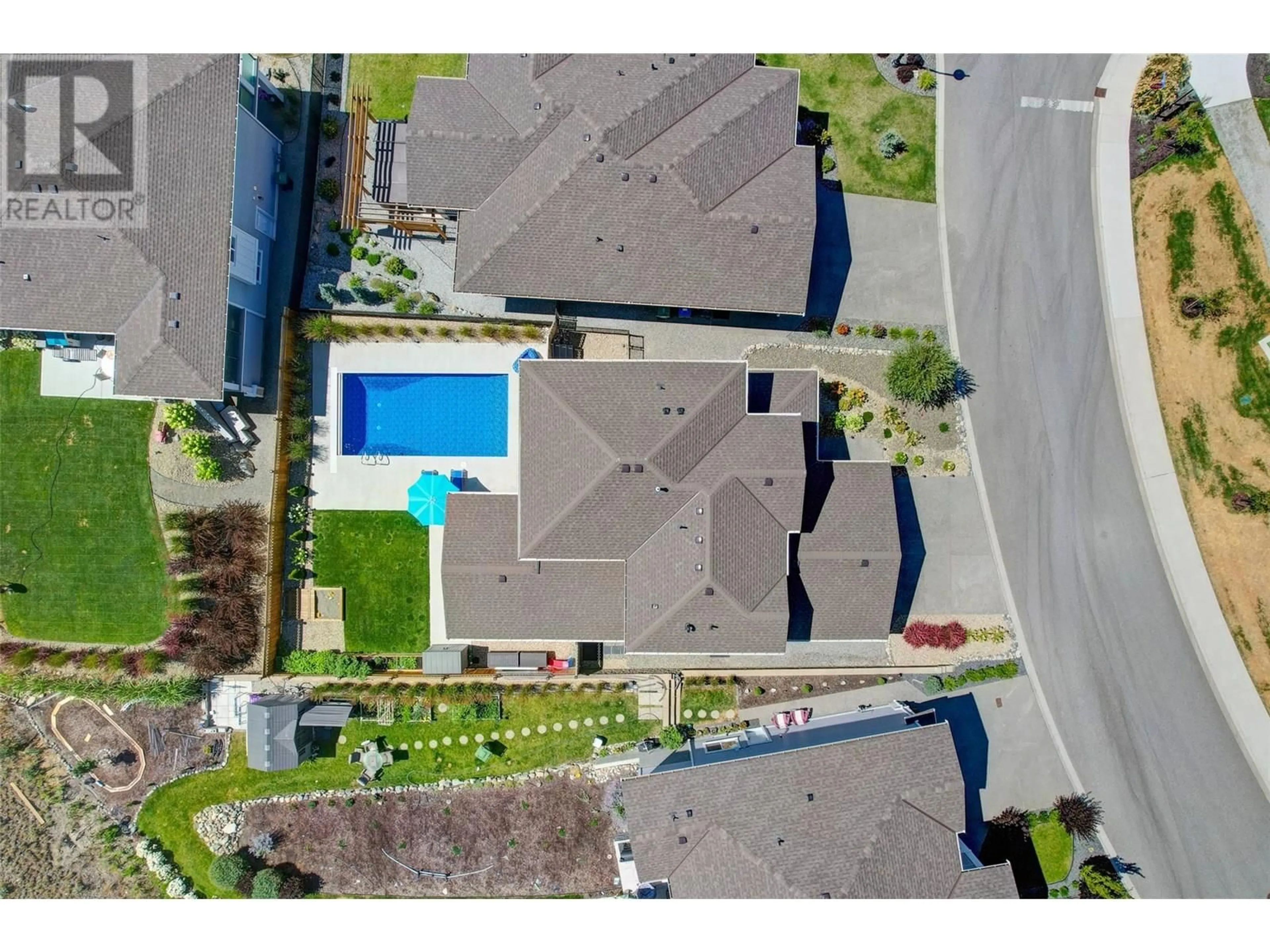 A pic from outside/outdoor area/front of a property/back of a property/a pic from drone, street for 1895 FOXTAIL TERRACE, Kelowna British Columbia V1P1T9
