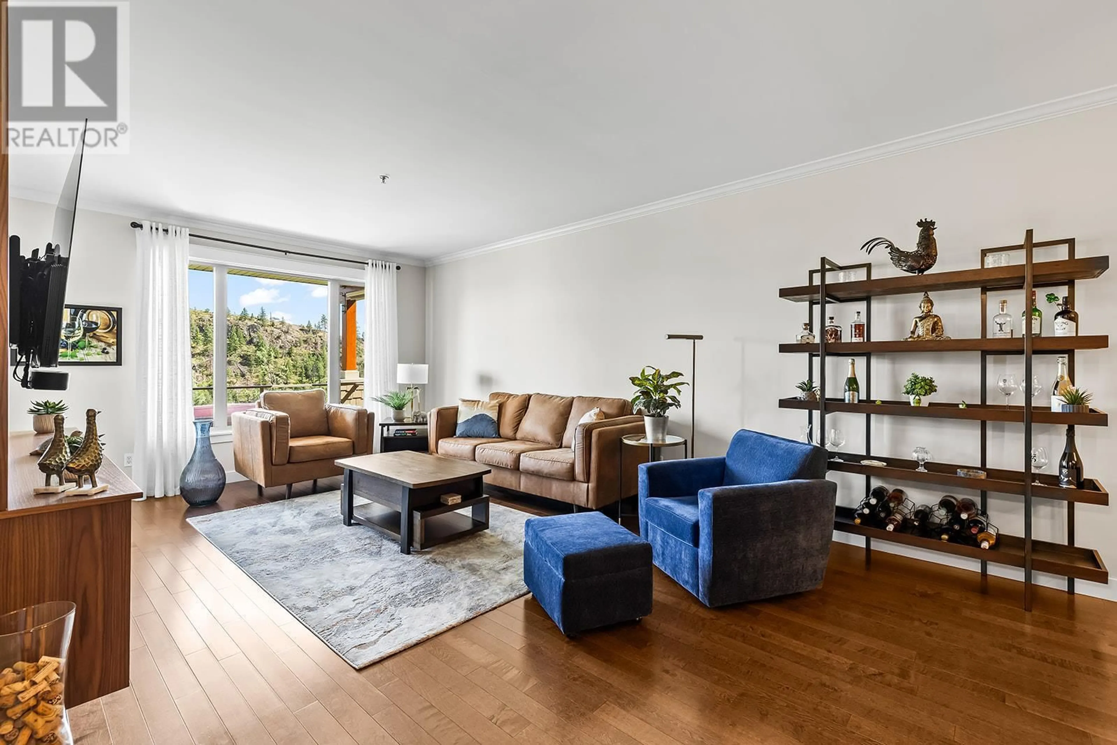 Living room with furniture, wood/laminate floor for 304 - 2470 TUSCANY DRIVE, West Kelowna British Columbia V4T3G8