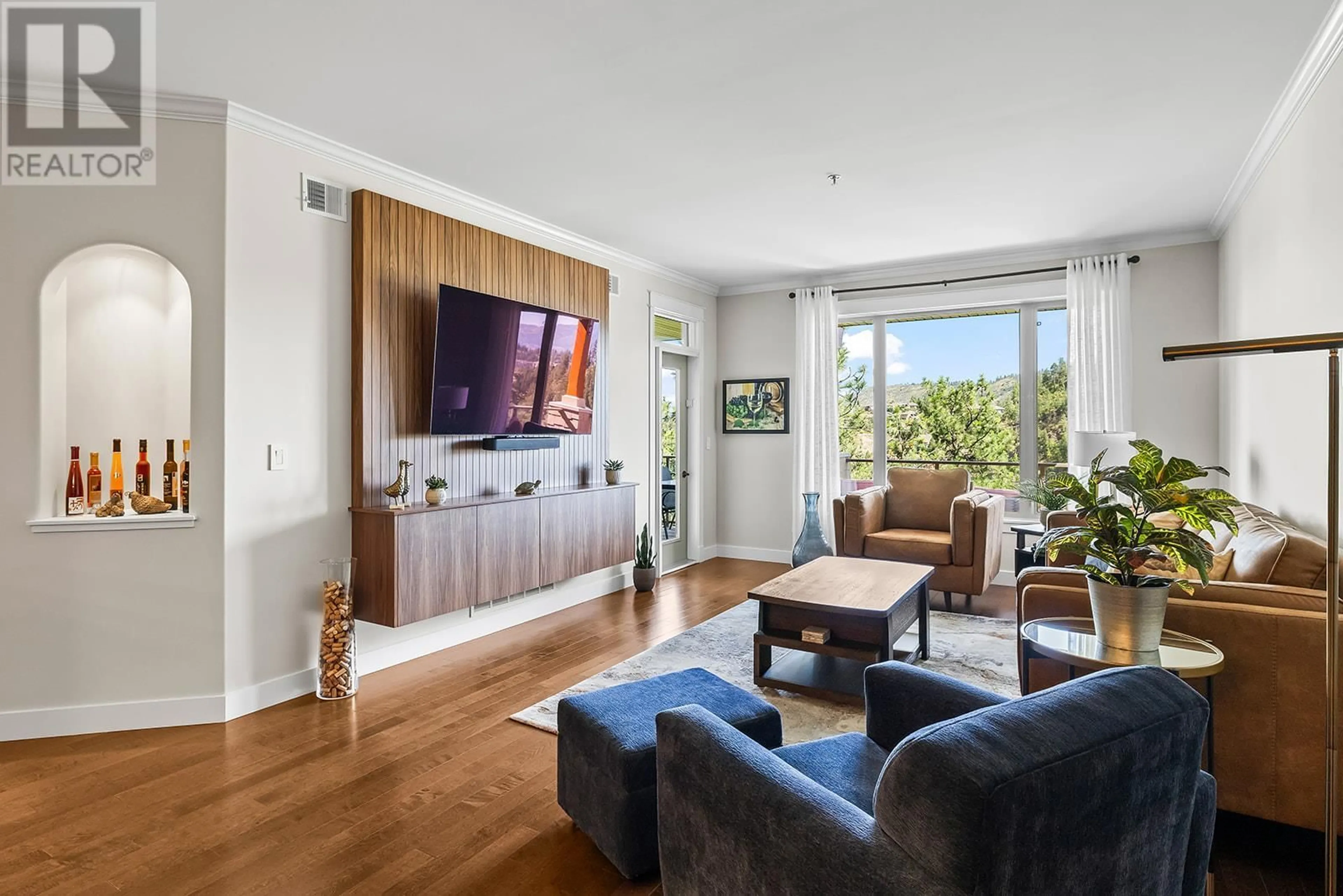 Living room with furniture, wood/laminate floor for 304 - 2470 TUSCANY DRIVE, West Kelowna British Columbia V4T3G8