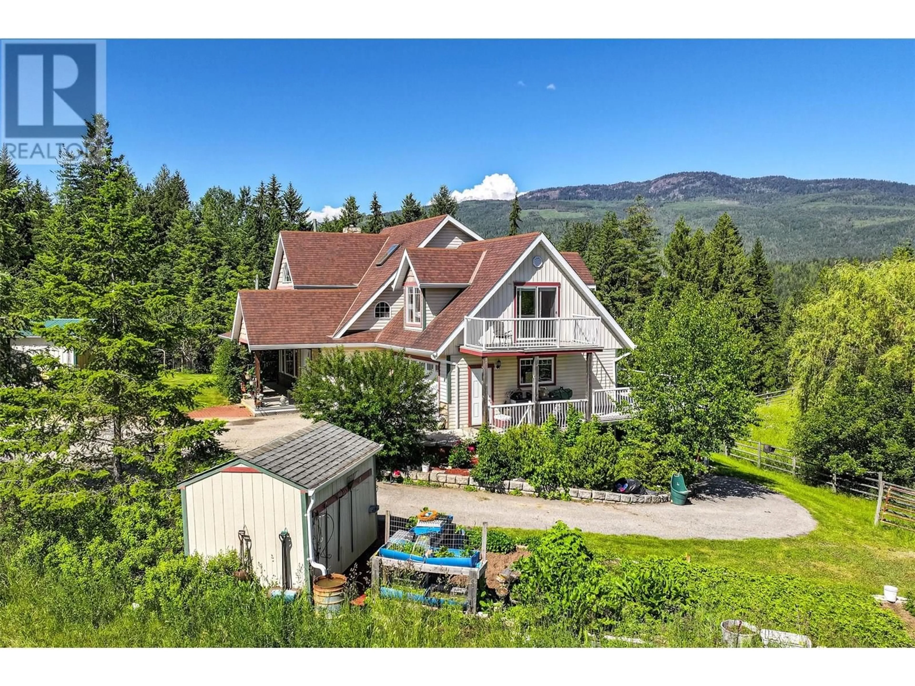 A pic from outside/outdoor area/front of a property/back of a property/a pic from drone, mountain view for 9255 FIREHALL FRONTAGE ROAD, Salmon Arm British Columbia V1E2X6