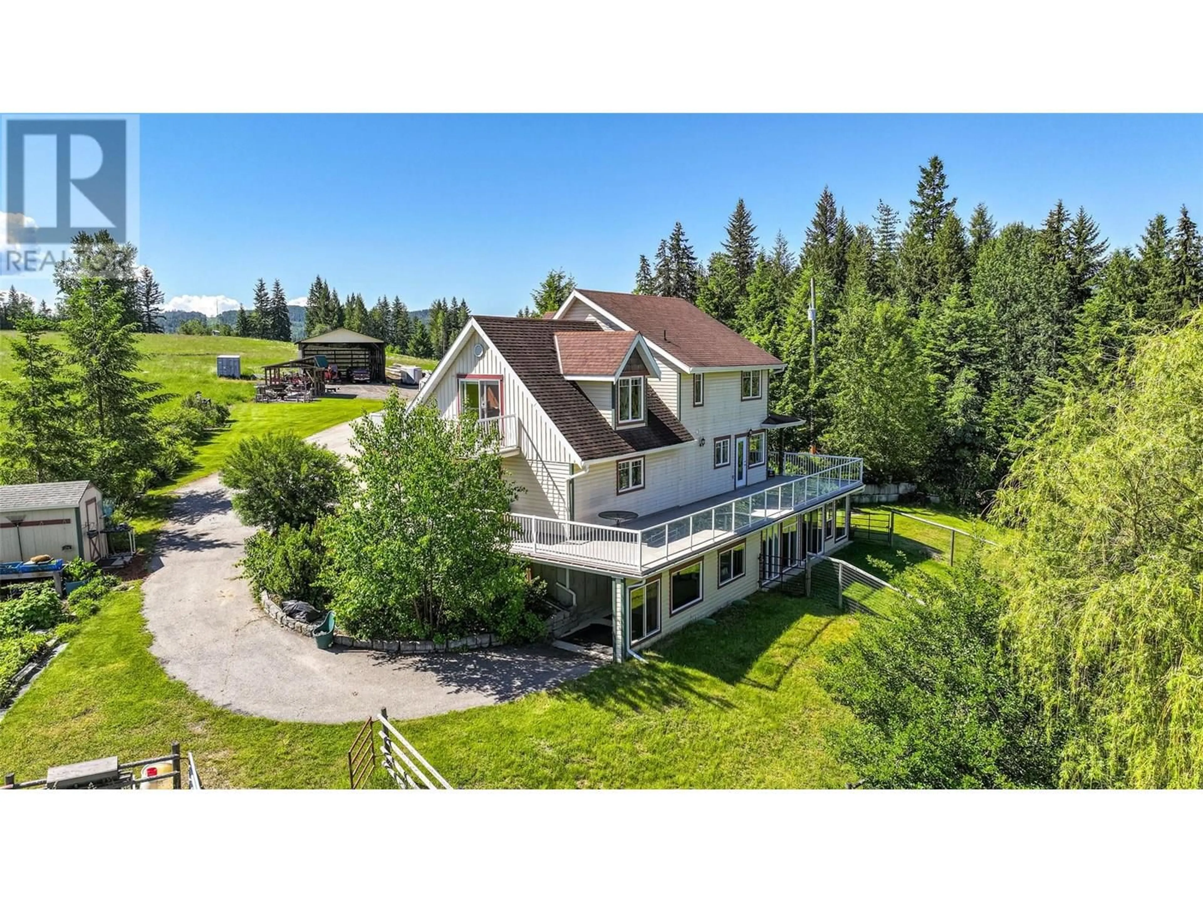 A pic from outside/outdoor area/front of a property/back of a property/a pic from drone, mountain view for 9255 FIREHALL FRONTAGE ROAD, Salmon Arm British Columbia V1E2X6