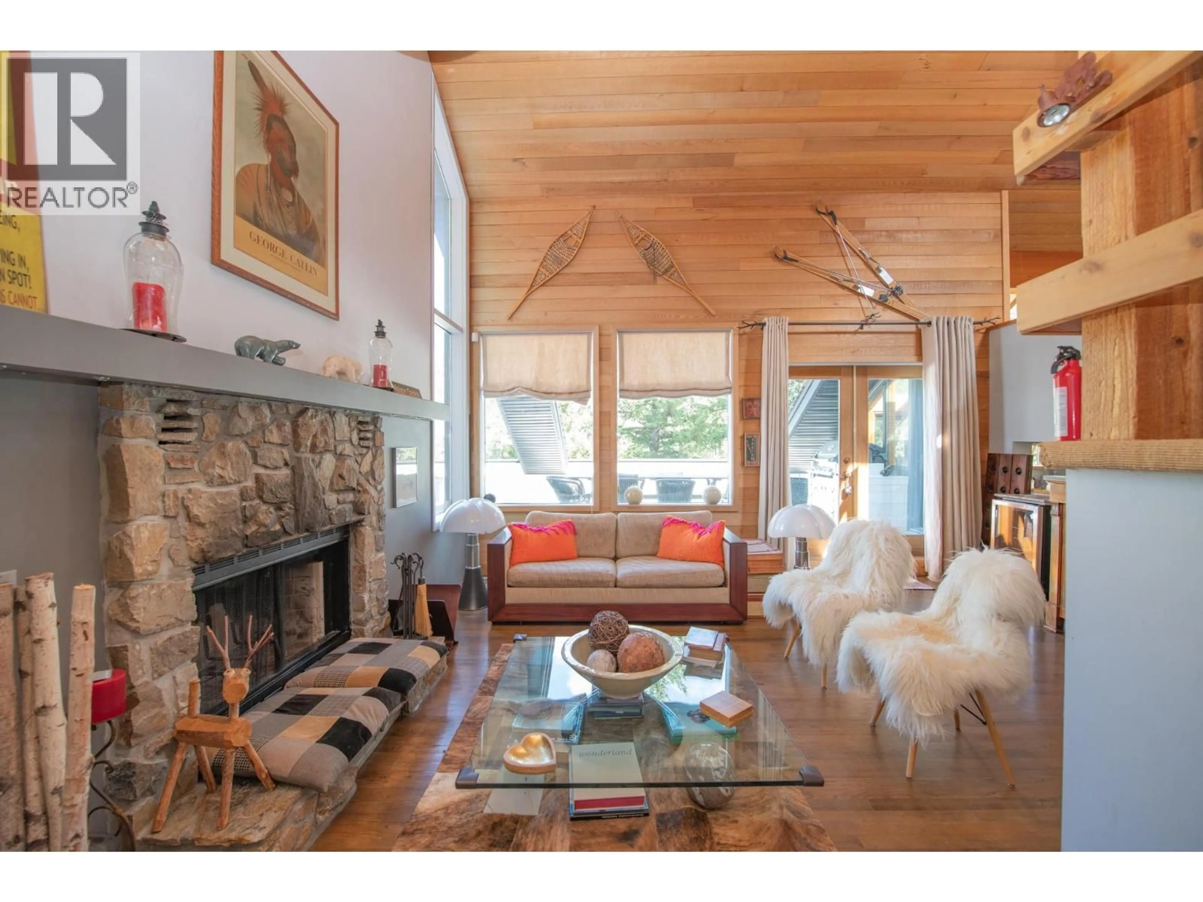Living room with furniture, wood/laminate floor for 13804 PONDEROSA WAY, Coldstream British Columbia V1B1A4