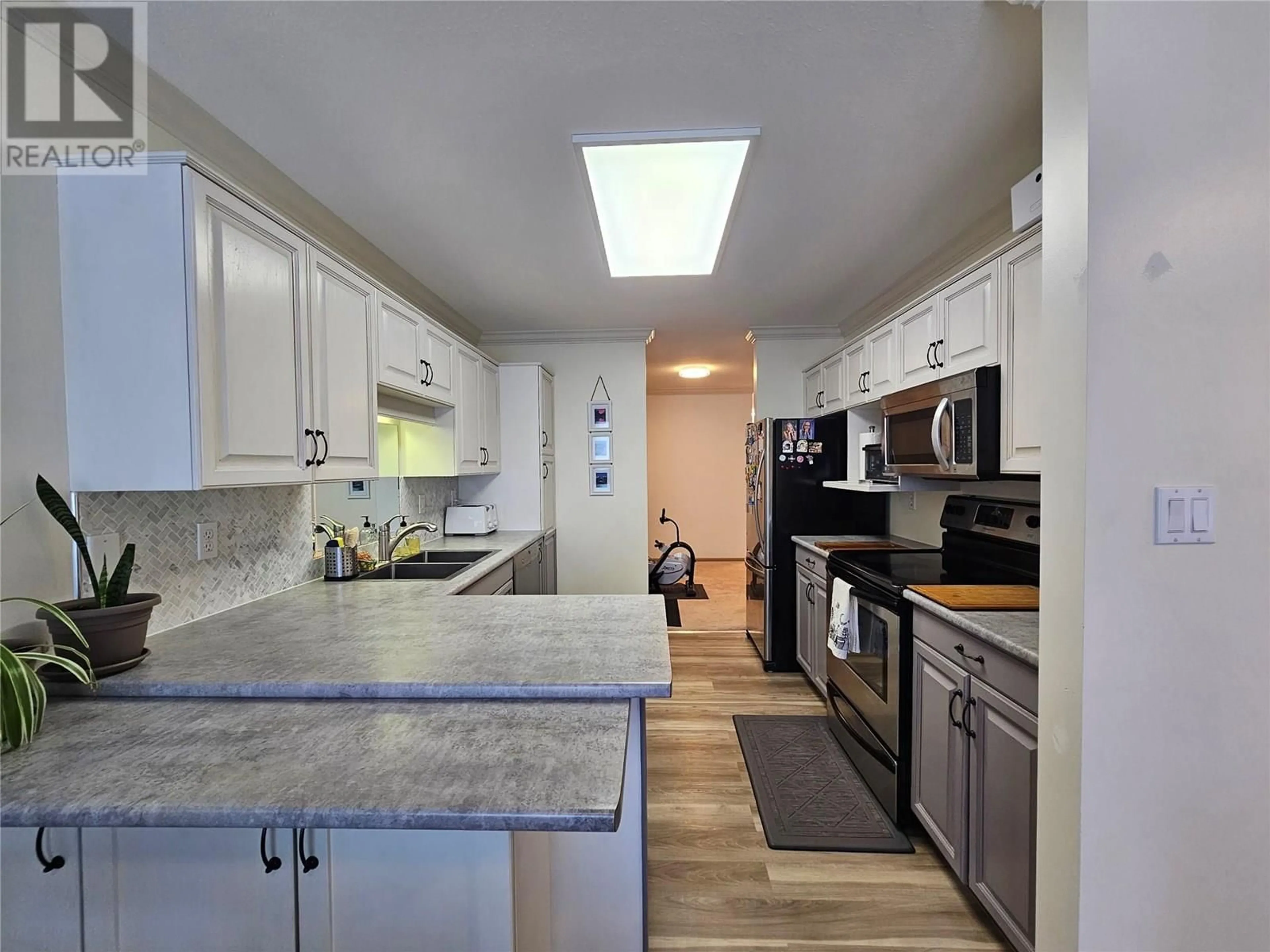 Open concept kitchen, ceramic/tile floor for 70 - 8907 PINEO COURT, Summerland British Columbia V0H1Z5