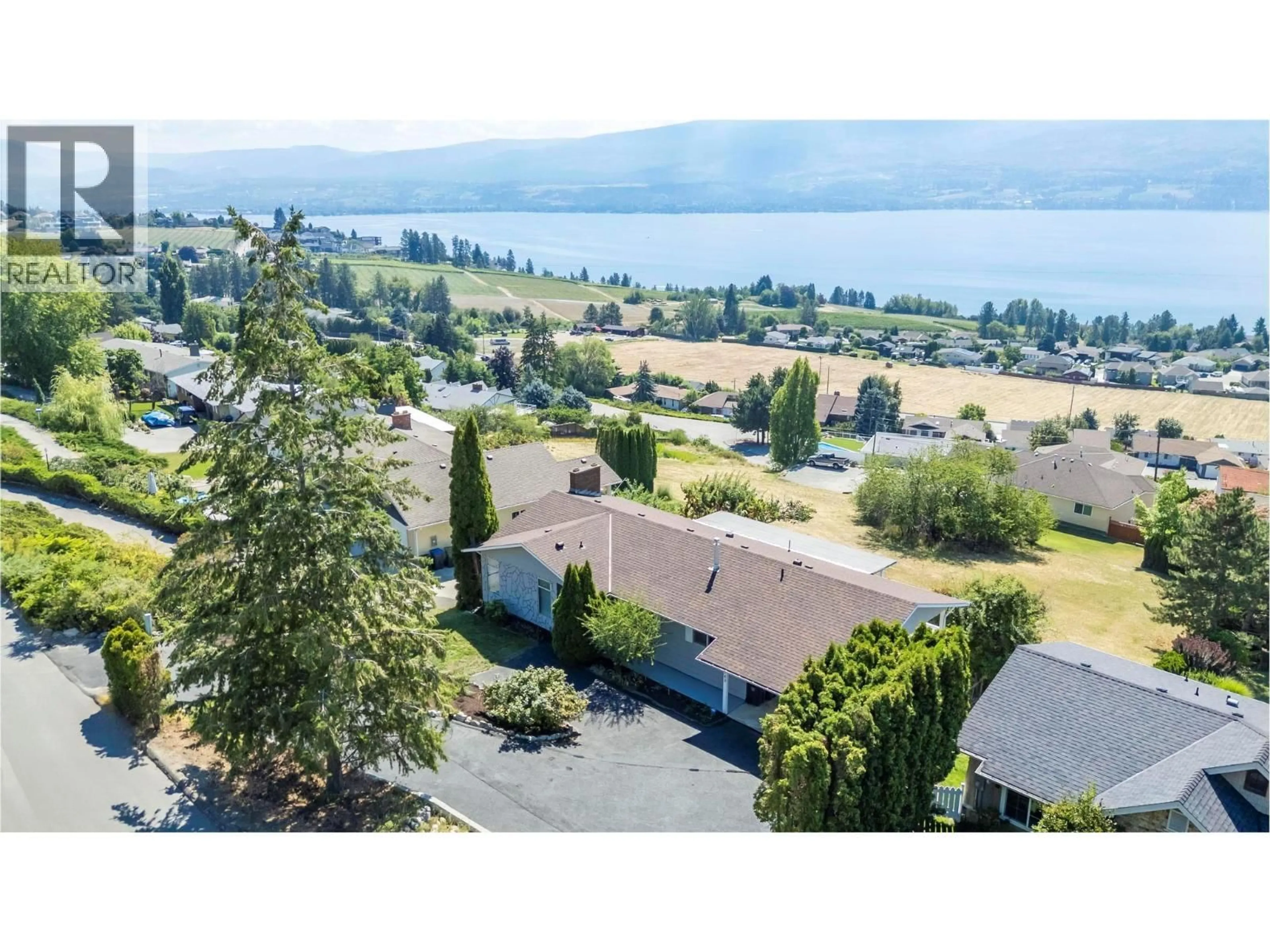 A pic from outside/outdoor area/front of a property/back of a property/a pic from drone, water/lake/river/ocean view for 1163 MENU ROAD, West Kelowna British Columbia V1Z2J6